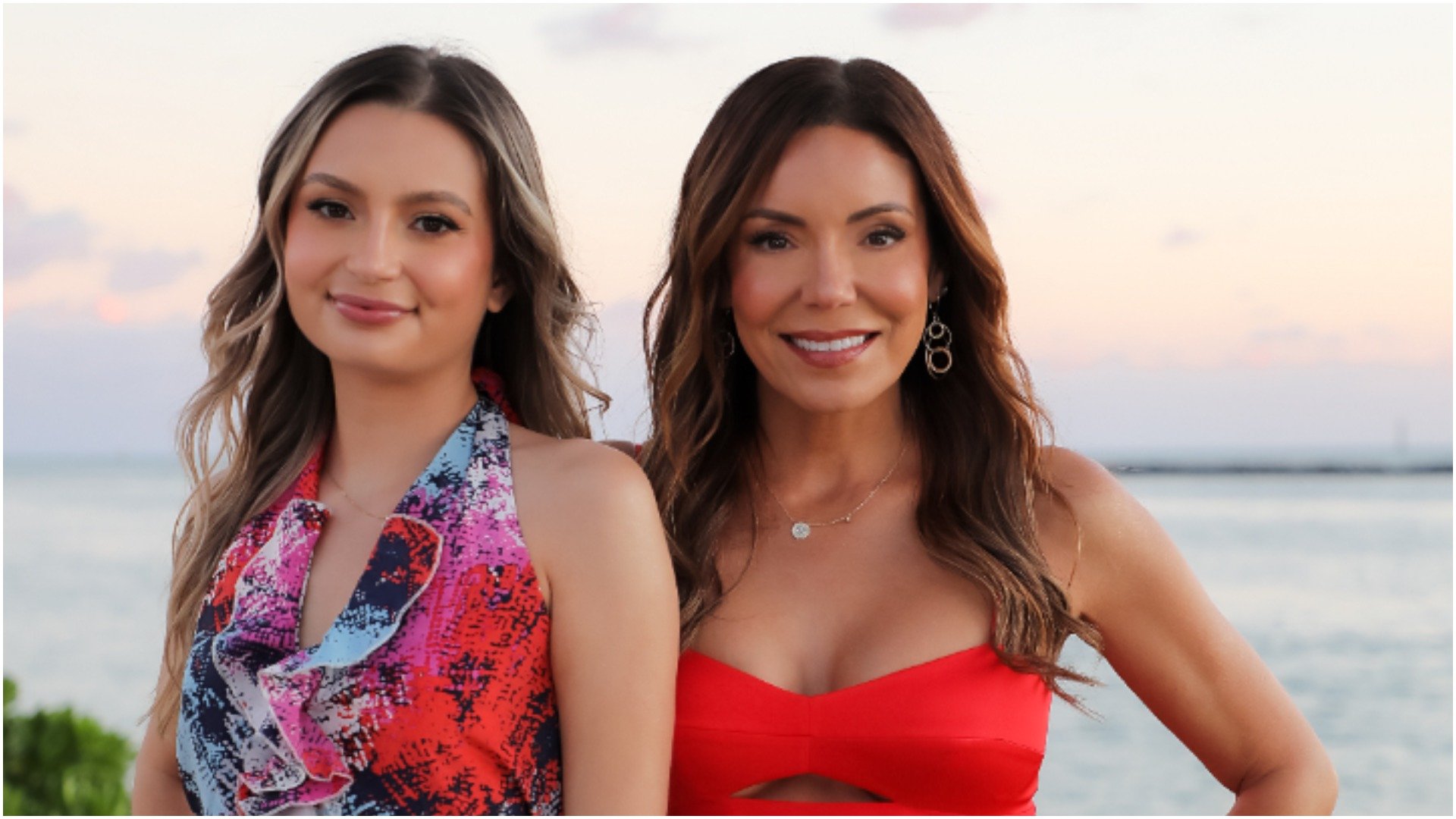 Breana Symone and Karen Larrea from 'My Mom Your Dad' pose on the beach 