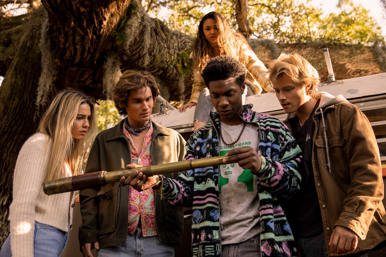 'Outer Banks' cast in a still from season 2 (L to R): Madelyn Cline, Chase Stokes, Jonathan Daviss, Rudy Pankow, and Madison Bailey on top of the car