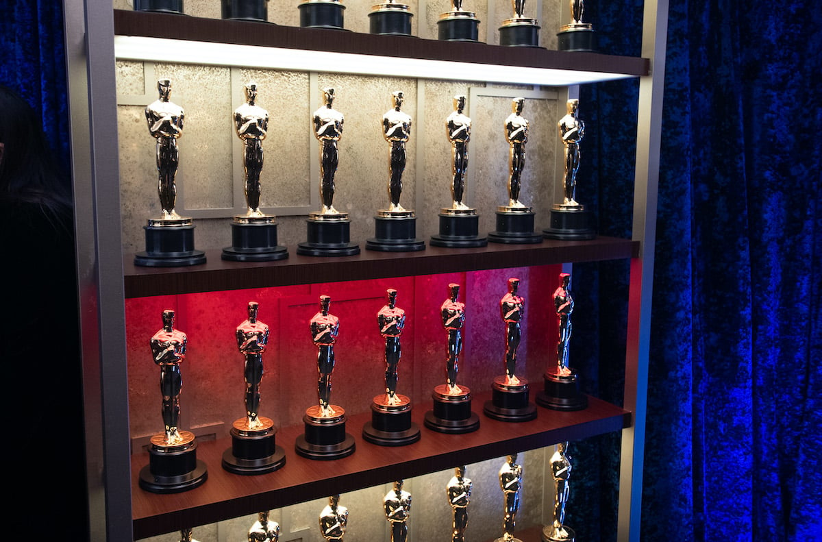 Rows of Academy Awards sit on shelves