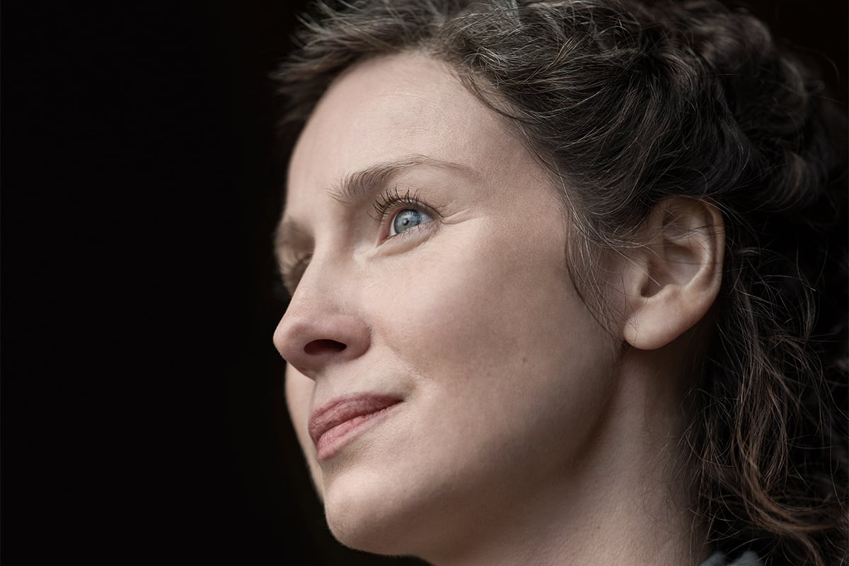 'Outlander' star Caitriona Balfe looks to the left with a serious expression