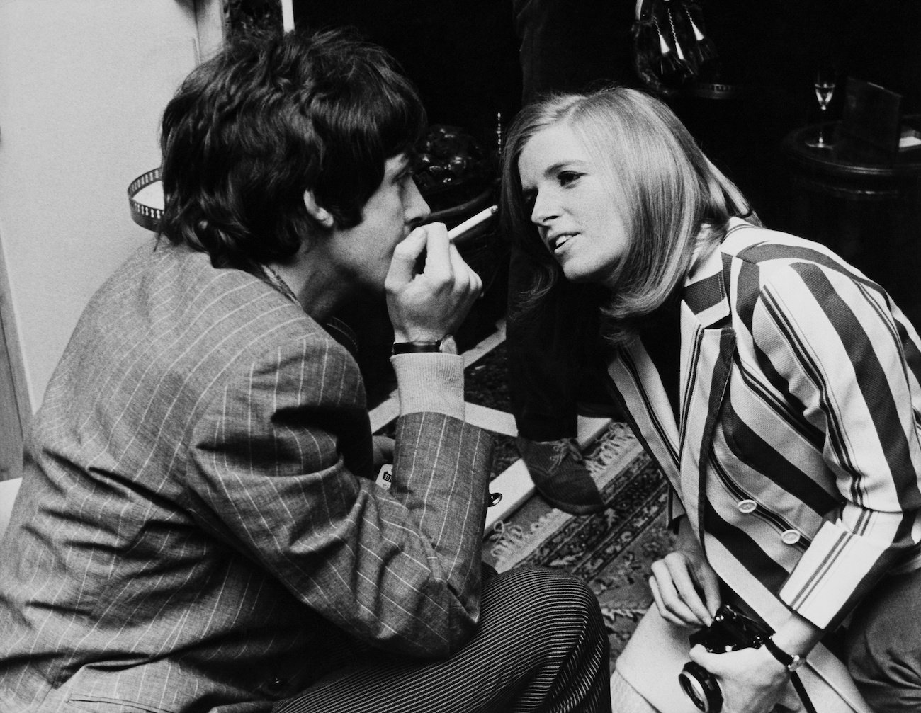 Paul McCartney in a suit and Linda Eastman in a dress in London, 1967.