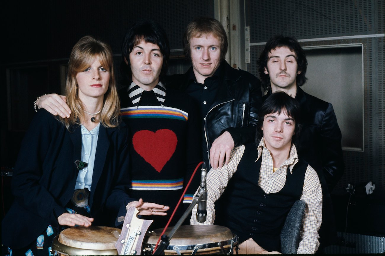 Paul McCartney and his wife Linda with their band Wings at Abbey Road Studios in 1974.