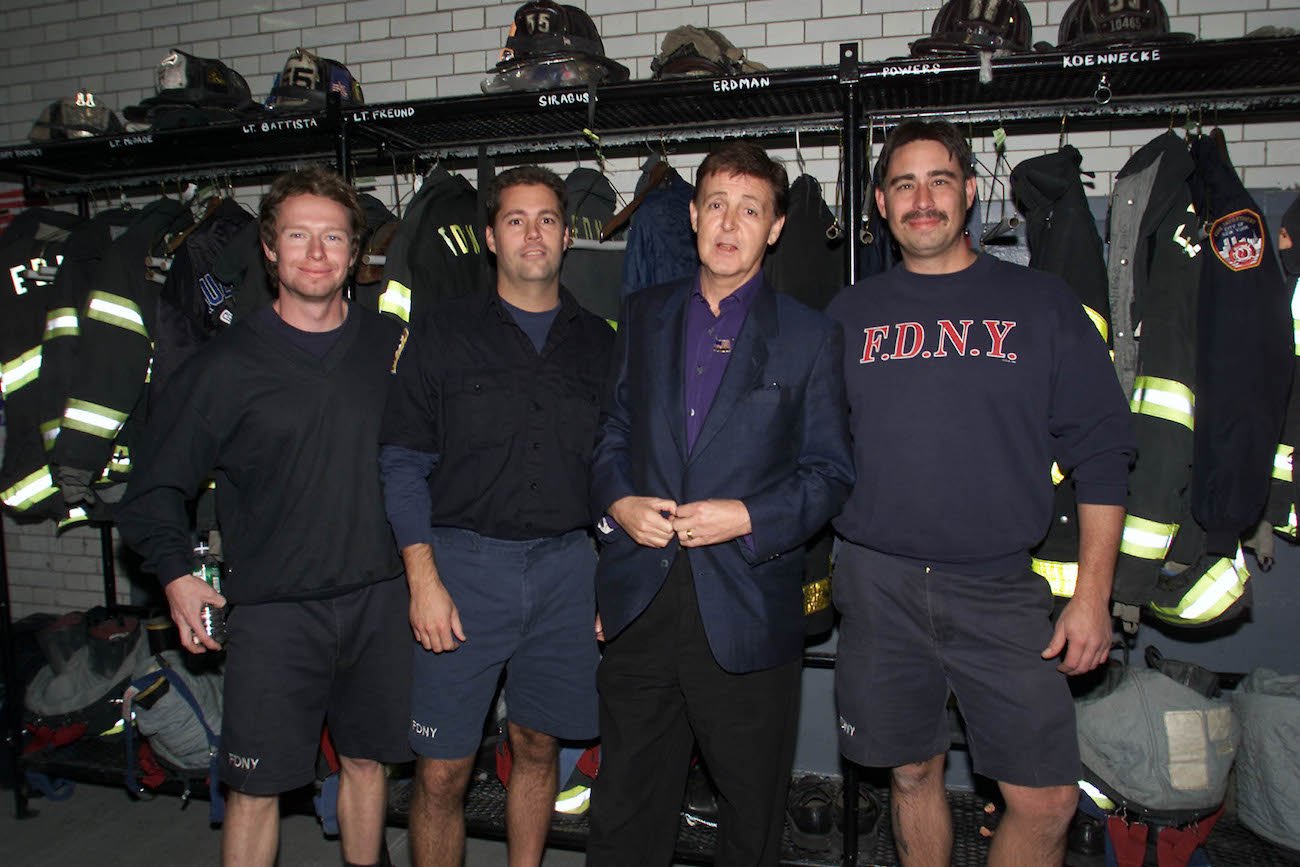 Paul McCartney giving firefighters tickets to the Concert for New York in 2001.
