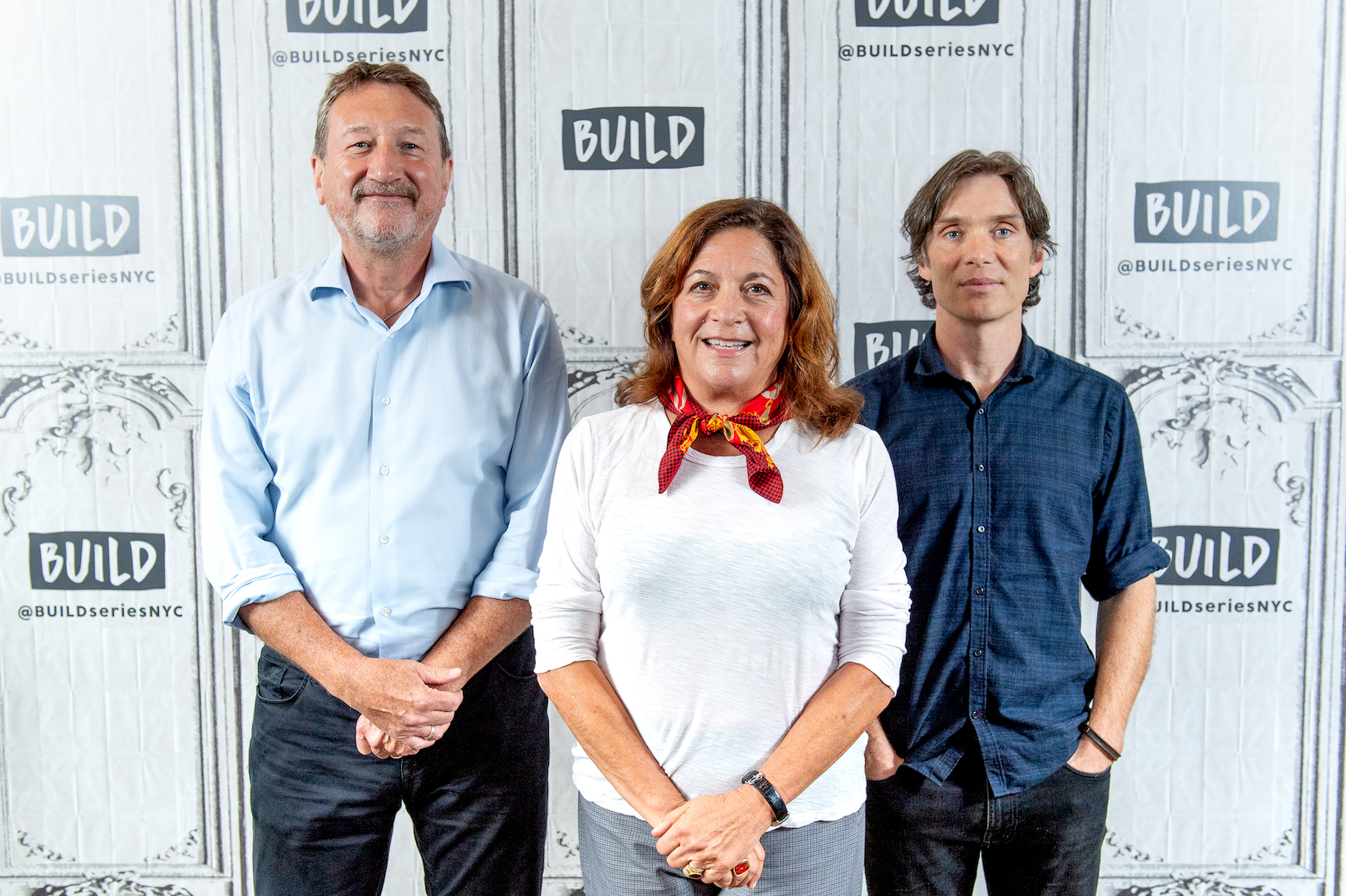 Steven Knight, Caryn Mandabach, and Cillian Murphy from 'Peaky Blinders' Season 6 standing together and smiling