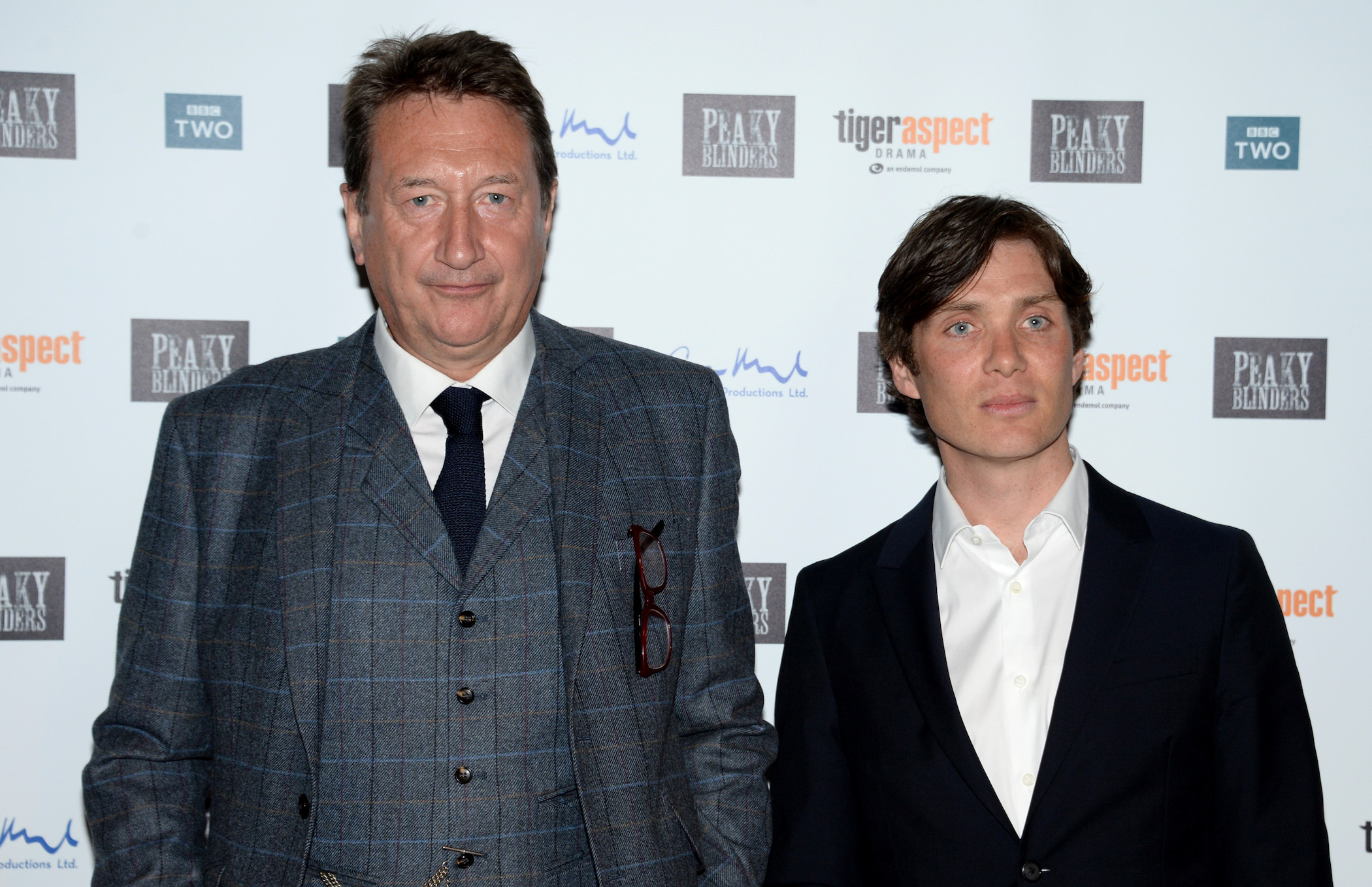 Steven Knight and Cillian Murphy from 'Peaky Blinders' Season 6 standing next to each other