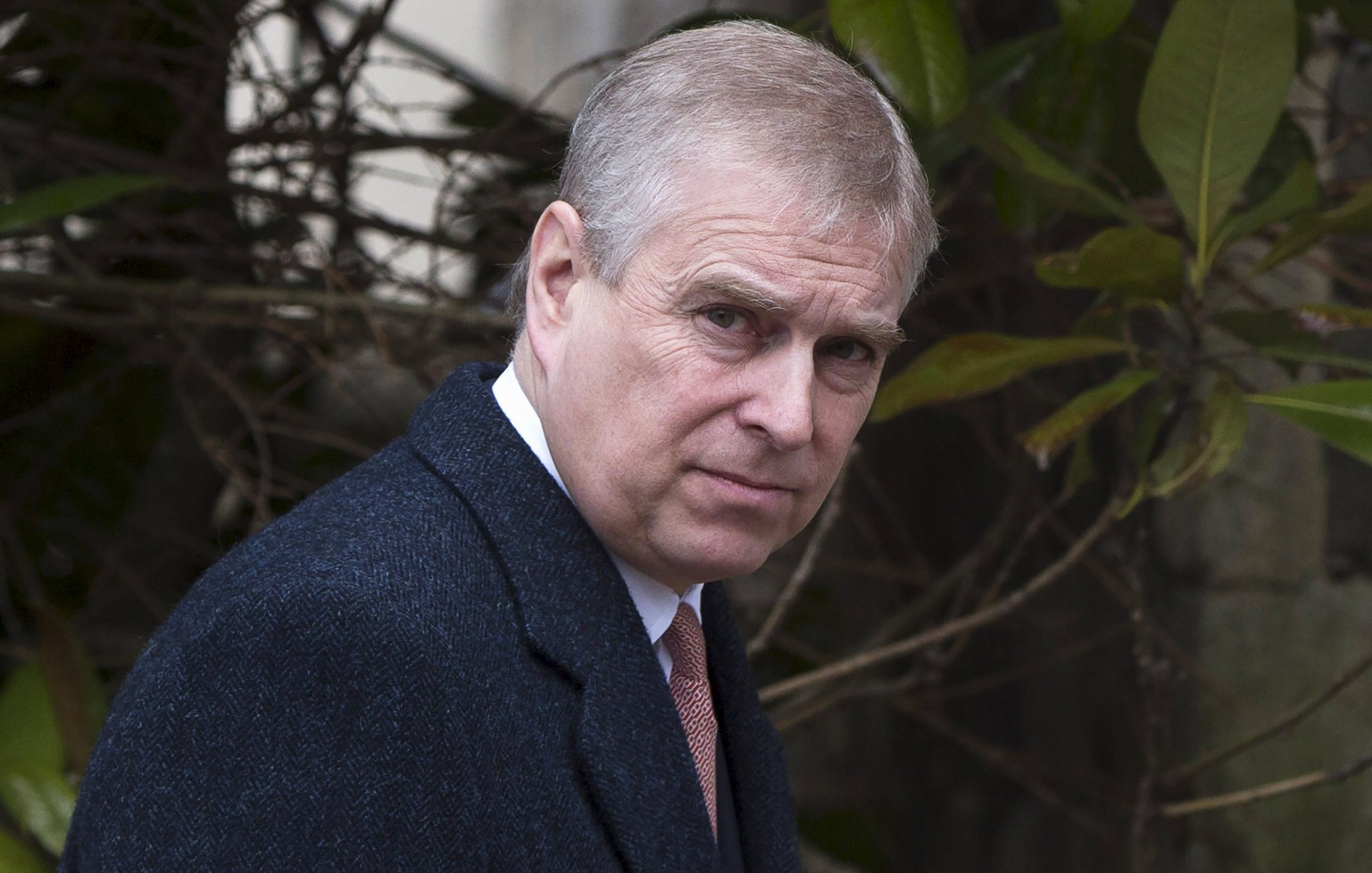 Prince Andrew dressed in a heavy coat with a suit and tie as he leaves the Easter Sunday service at St George's Chapel