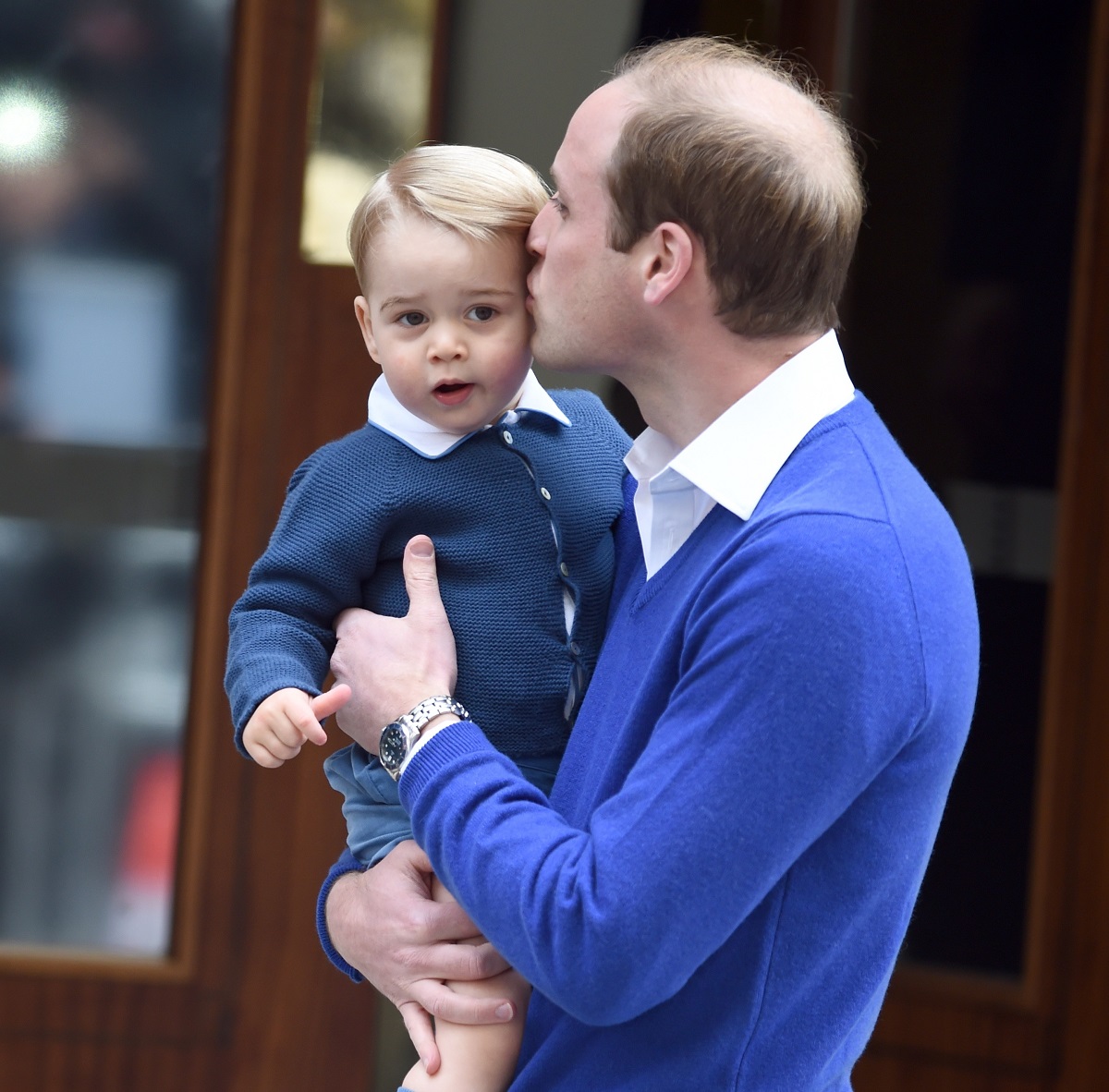 Prince William giving his son Prince George a kiss outside the Lindo Wing at St. Mary's Hospital