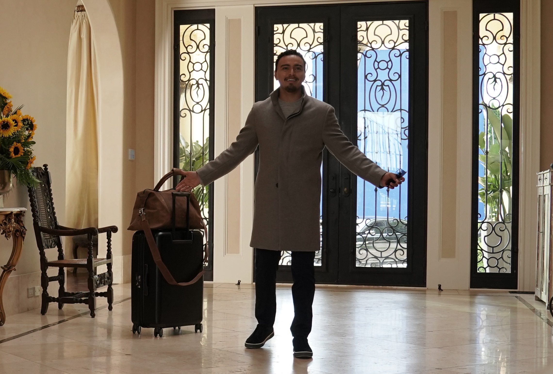 'Promised Land' Pilot episode Tonatiuh walks with his suitcase happy to be home as Antonio Sandoval