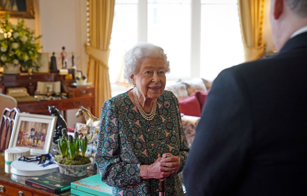 Queen Elizabeth II speaks with incoming Defence Service Secretaries Major General Eldon Millar during an in-person audience at the Windsor Castle, in Windsor, on February 16, 2022