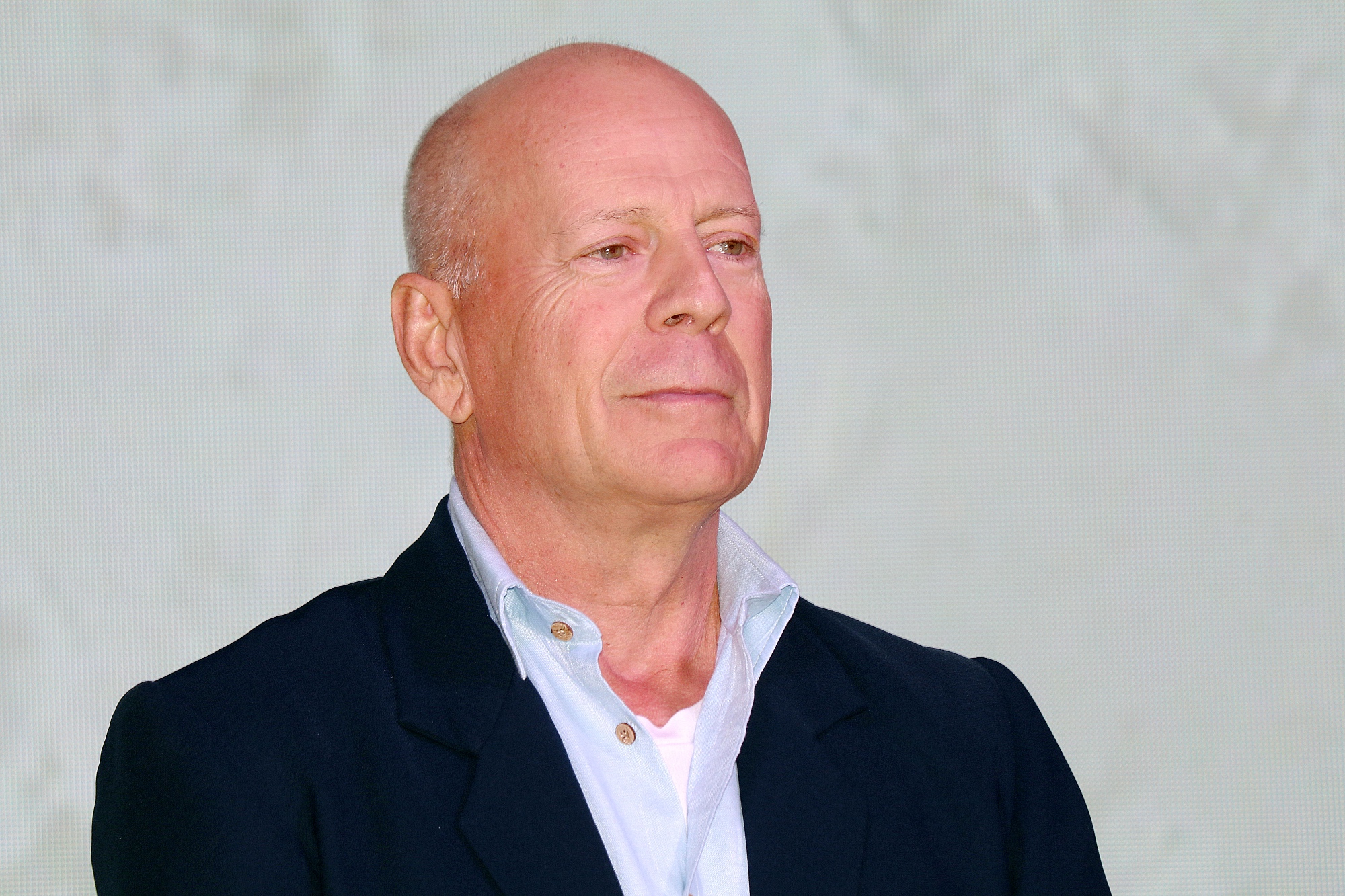 Razzie Awards 2022 Bruce Willis category nominations wearing a suit in front of white background