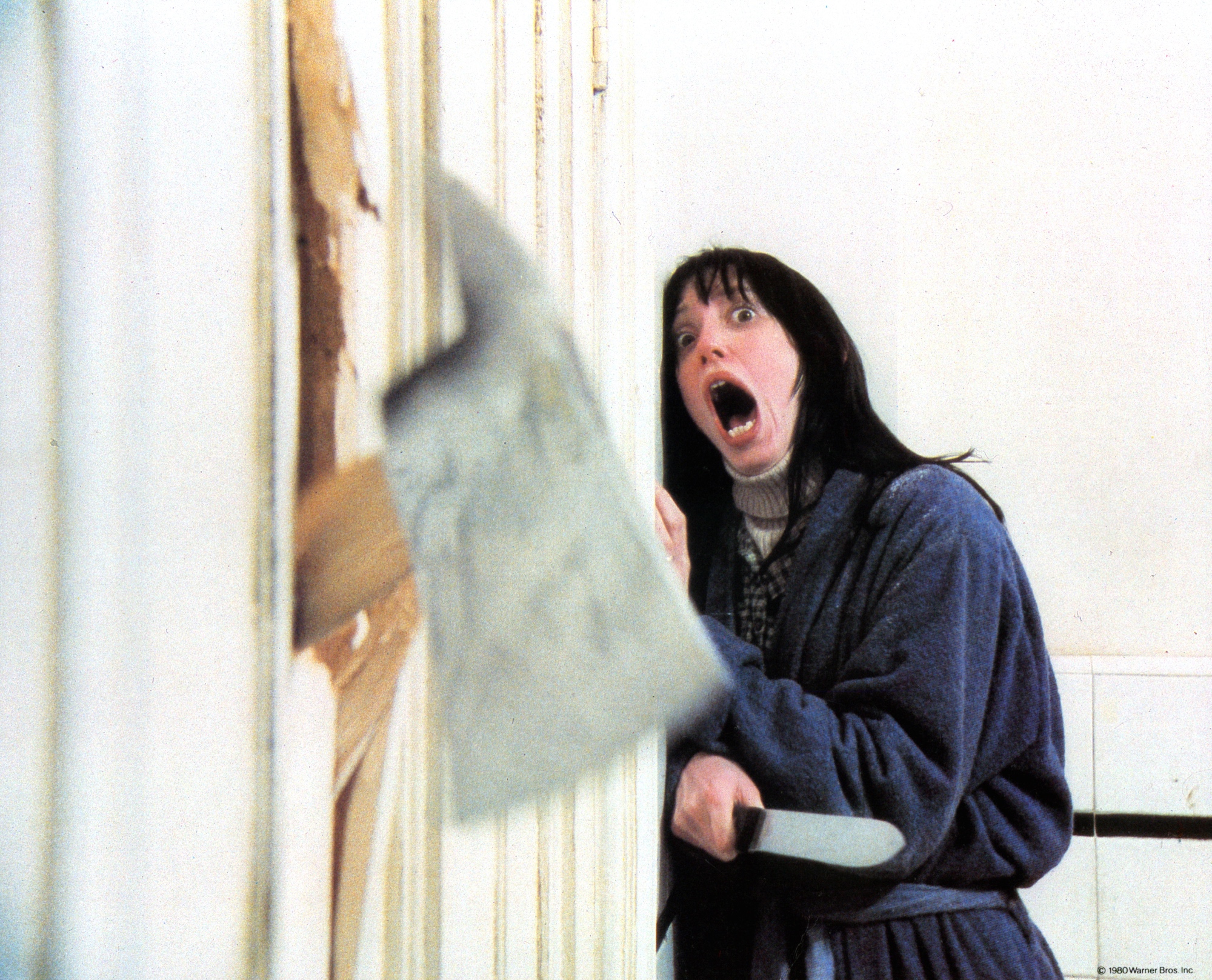 Razzie nominee 'The Shining' actor Shelley Duvall as Wendy Torrance screaming holding a knife