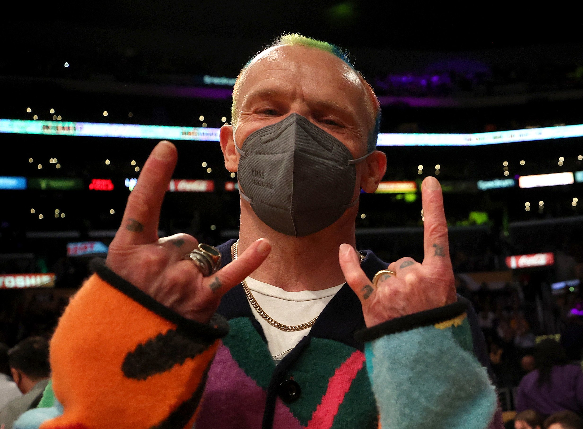 Red Hot Chili Peppers bassist Flea giving the Westside sign at a Los Angeles Lakers game