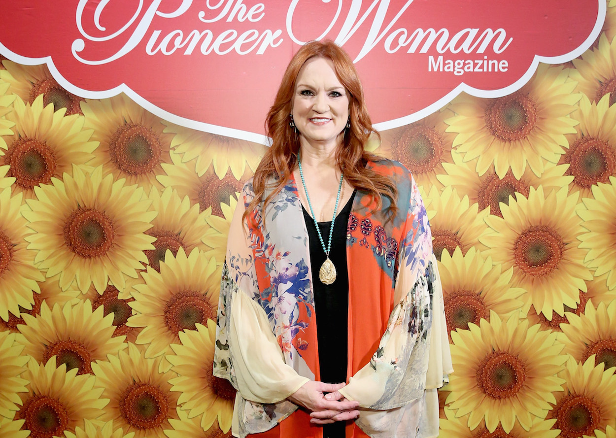 Ree Drummond smiles clasping her hands together in front of her