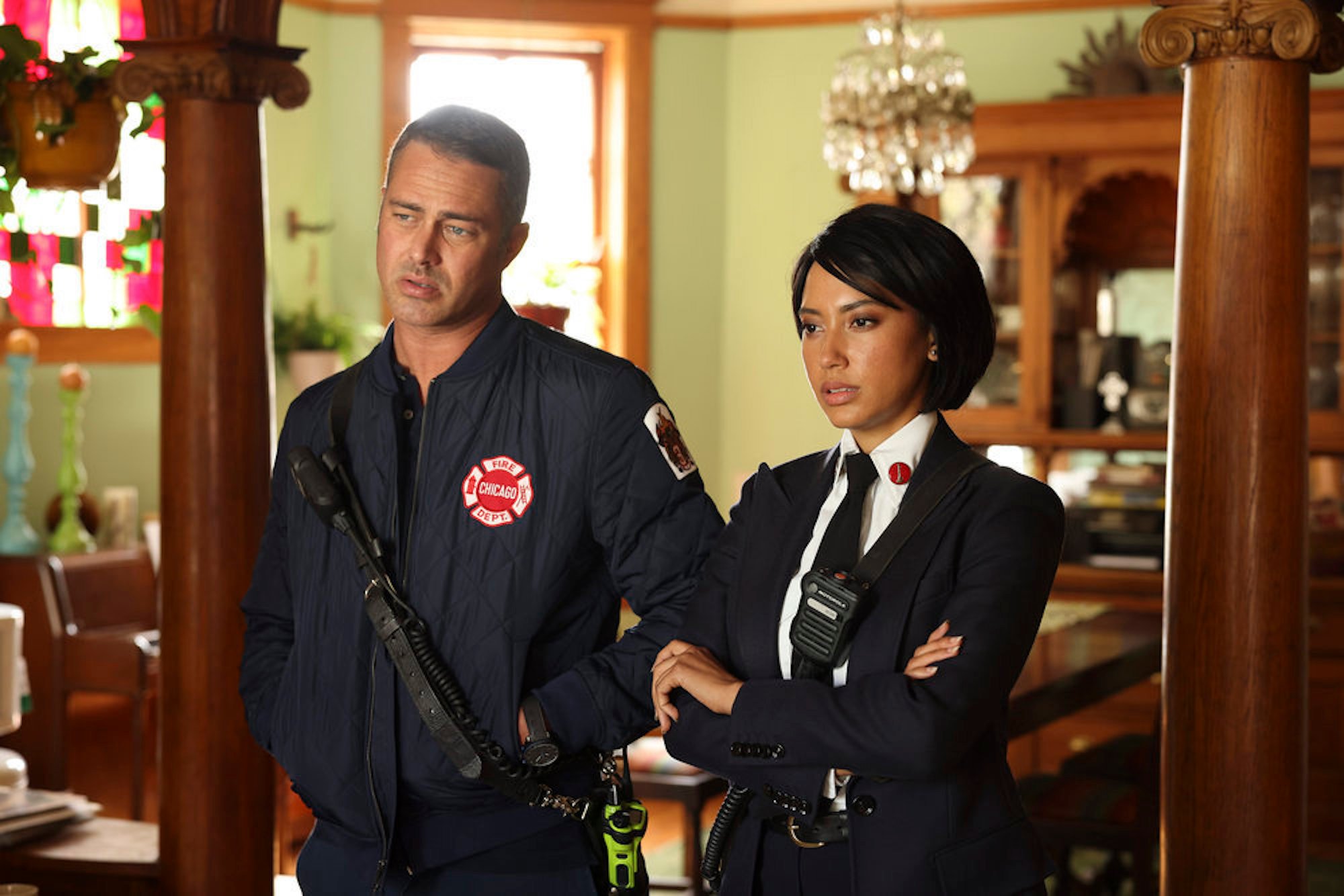 Taylor Kinney as Kelly Severide and Andy Allo as Wendy Seager standing next to each other in 'Chicago Fire' Season 10