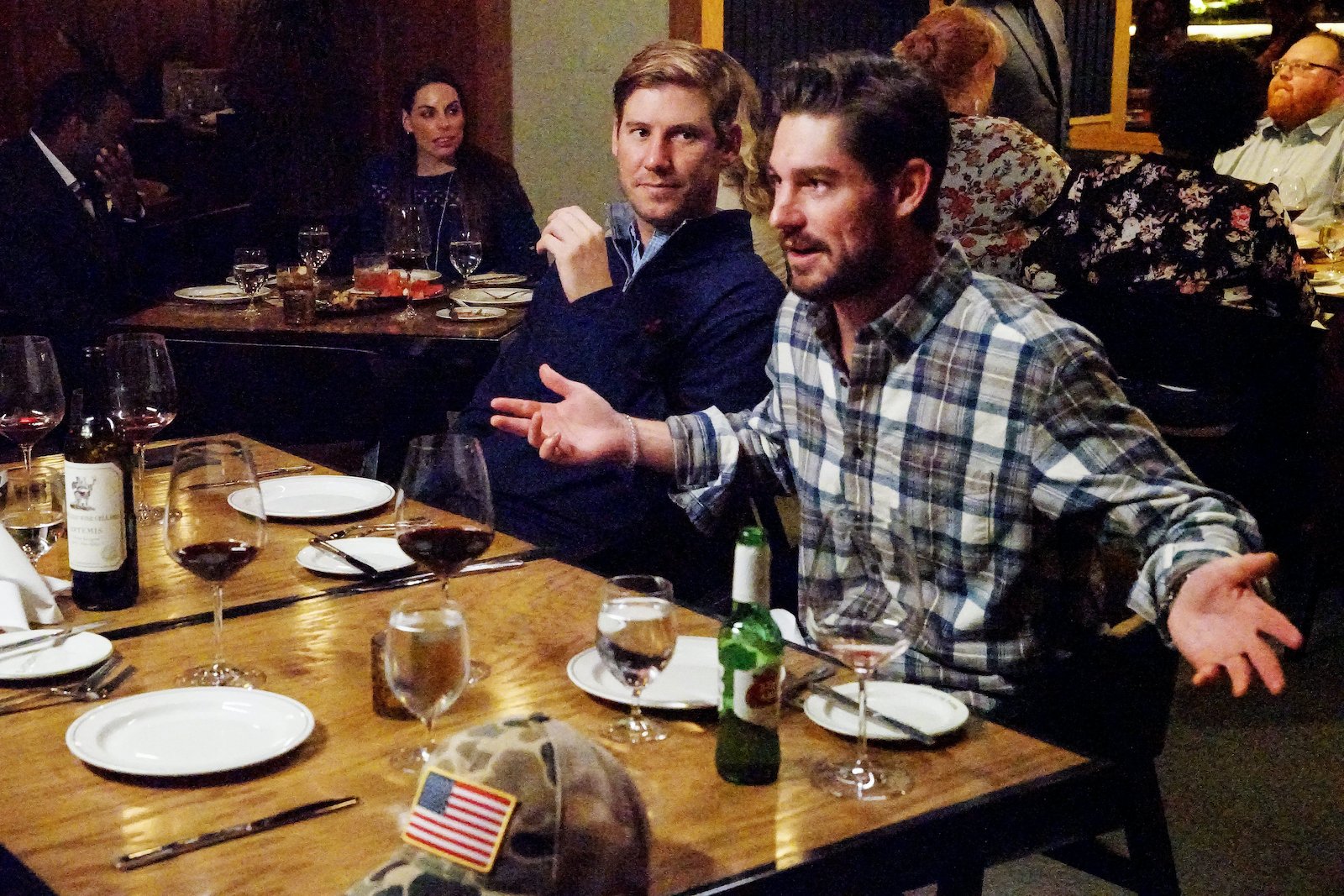 Austen Kroll and Craig Conover have a conversation over dinner and drinks