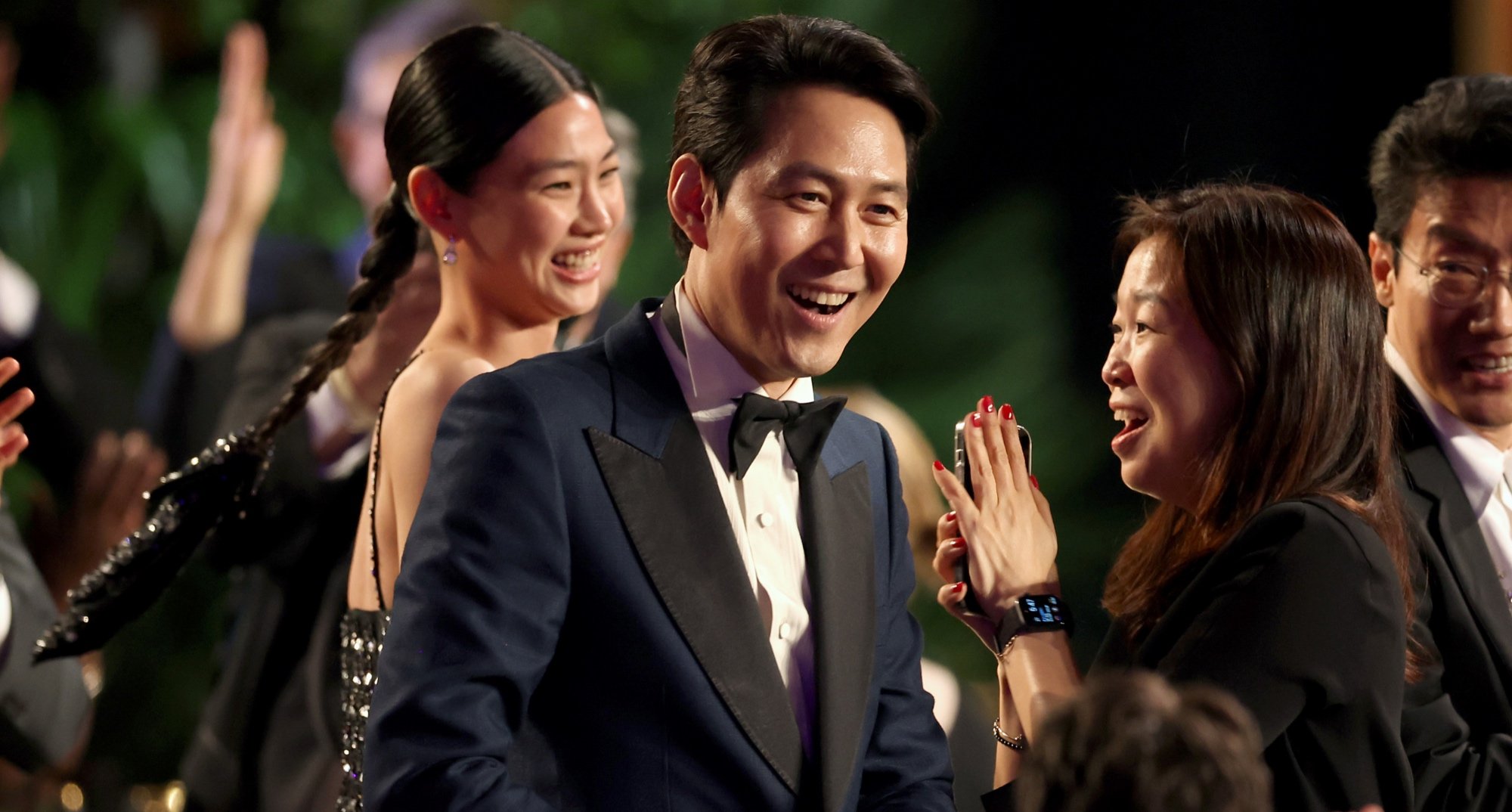 'Squid Game' actor Lee Jung-jae at SAG Awards surrounded by the cast.