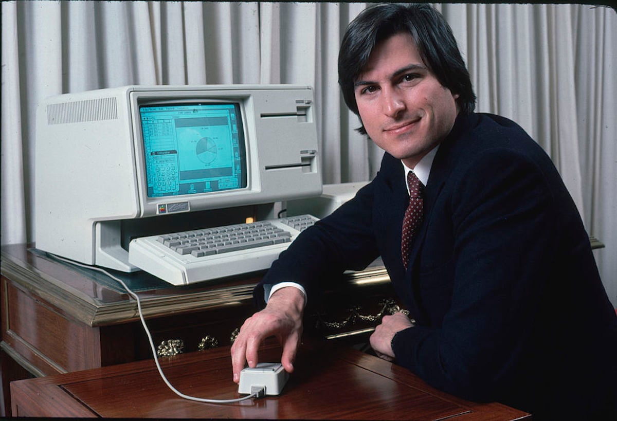 Steve Jobs with a new Lisa computer during a press preview