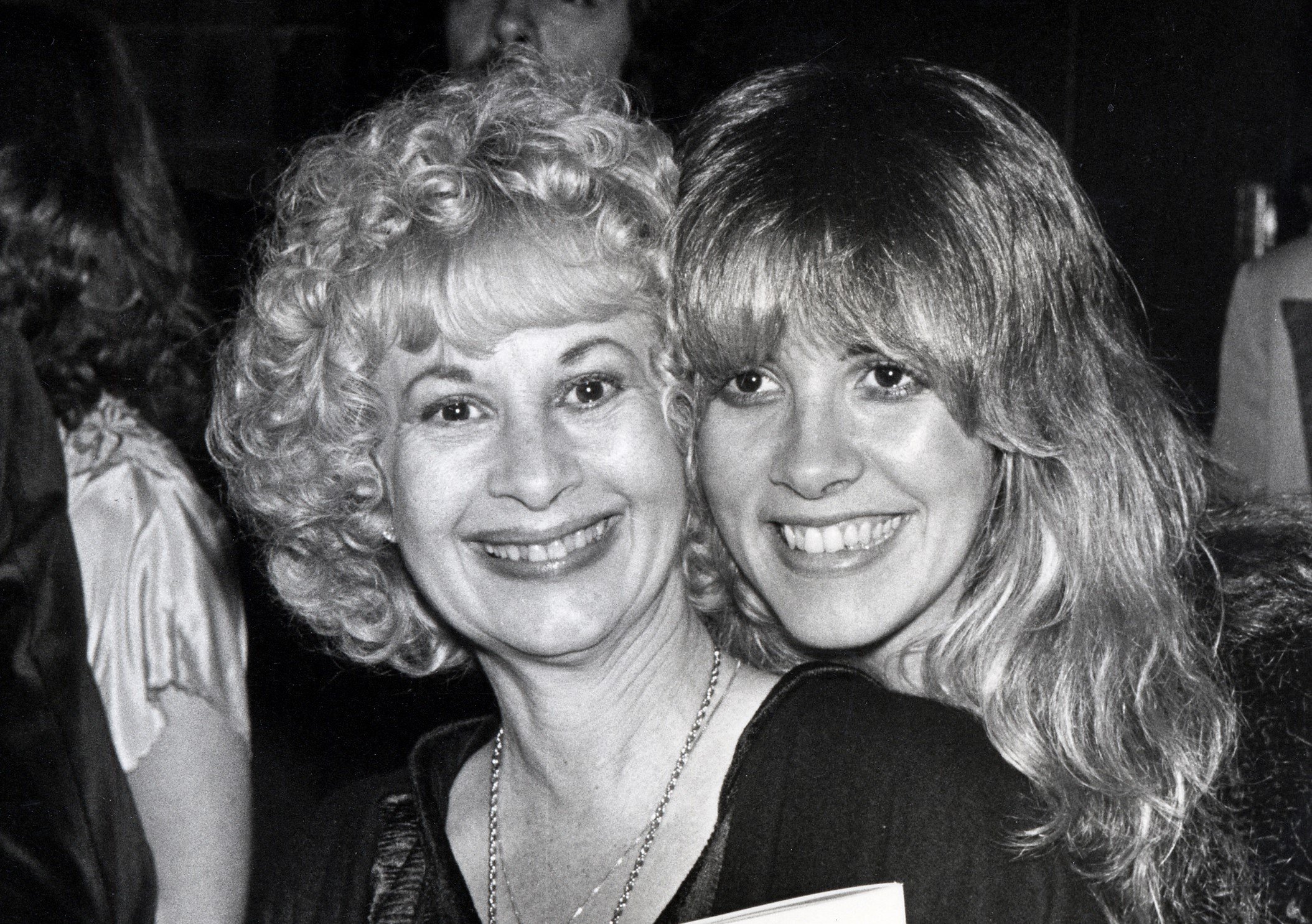 A black and white photo of Stevie Nicks posing cheek to cheek with her mother Barbara Nicks.