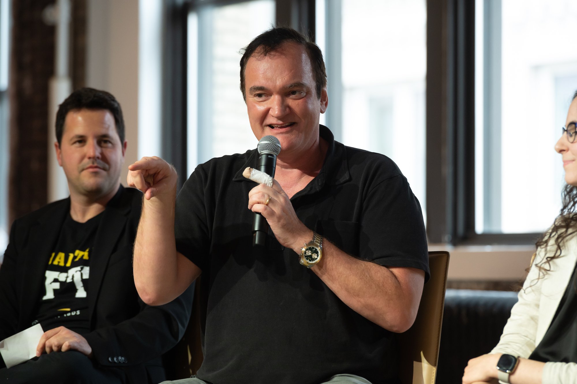'Super Pumped' narrator Quentin Tarantino speaks and points on a panel