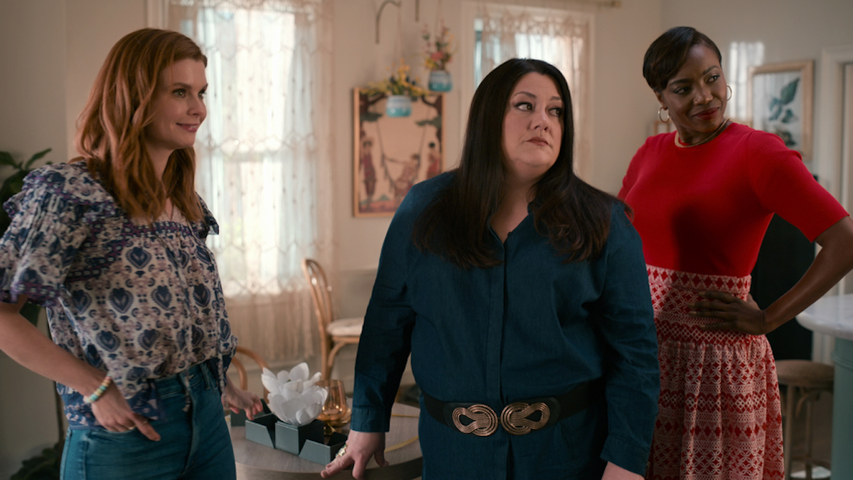 Maddie, wearing a peasant blouse, Dana Sue, in a blue top, and Helen, in a short-sleeved red top, in 'Sweet Magnolias' Season 2 
