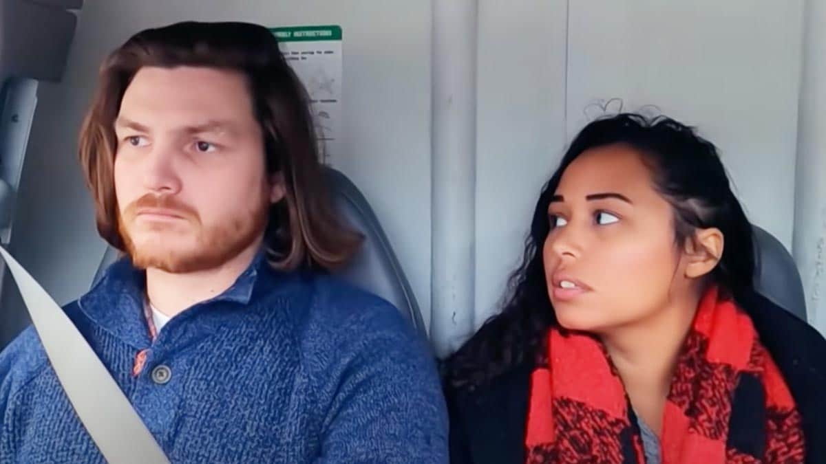 Syngin Colchester and Tania Maduro riding together in a moving van on '90 Day Fiancé.'