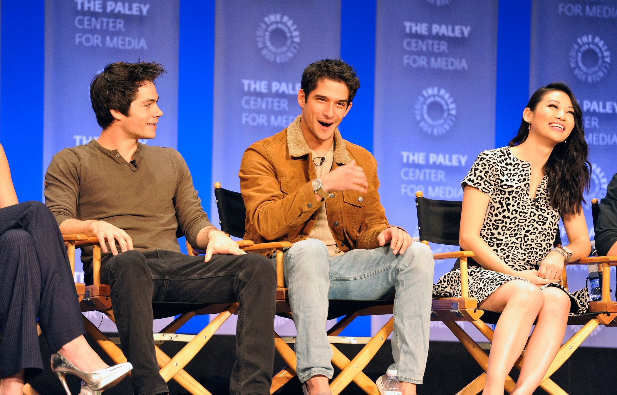 Dylan O'Brien, Tyler Posey, and Arden Cho from the 'Teen Wolf' cast speaking onstage