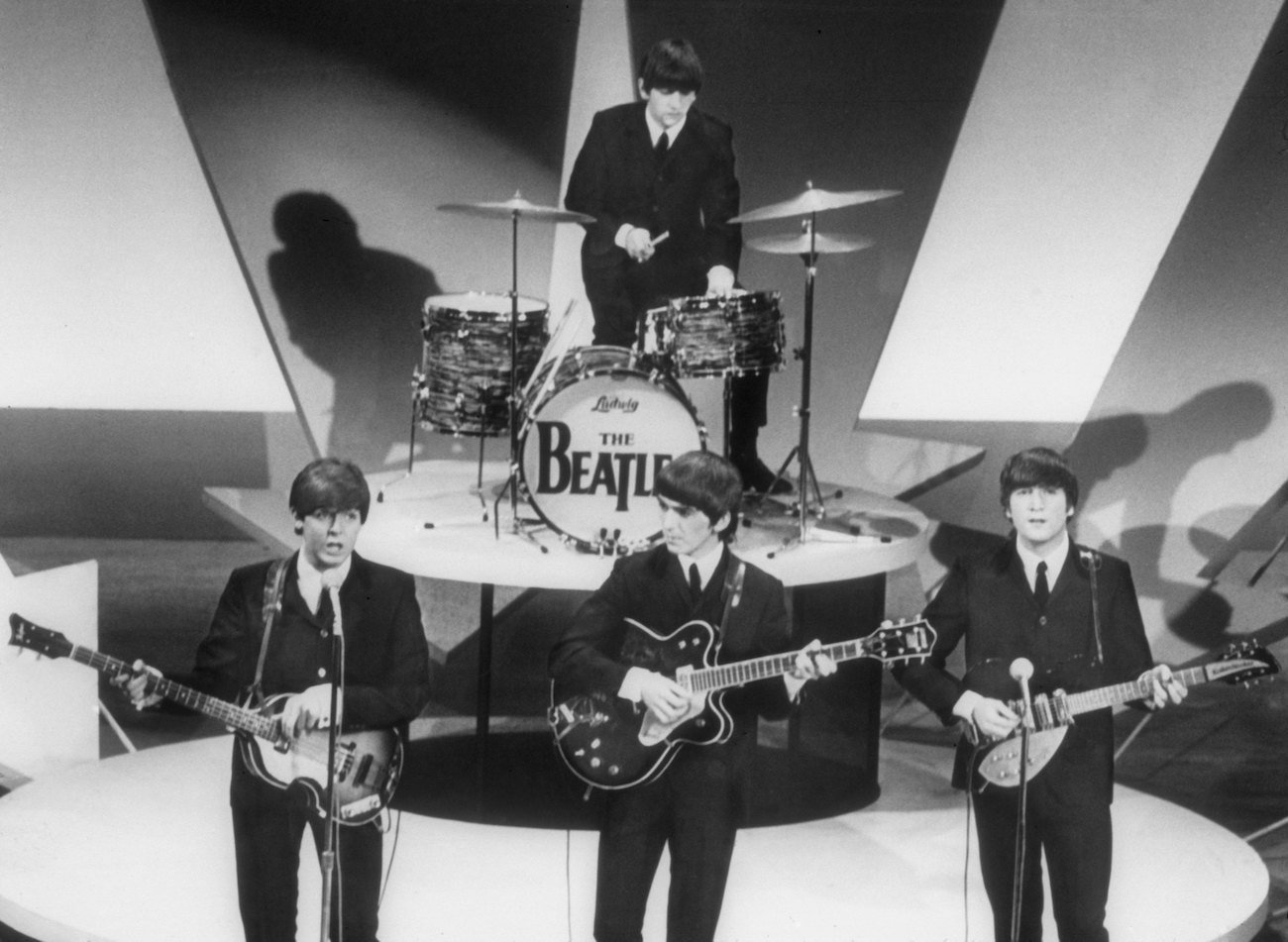 The Beatles in suits while performing on 'The Ed Sullivan Show' on Feb. 9, 1964.