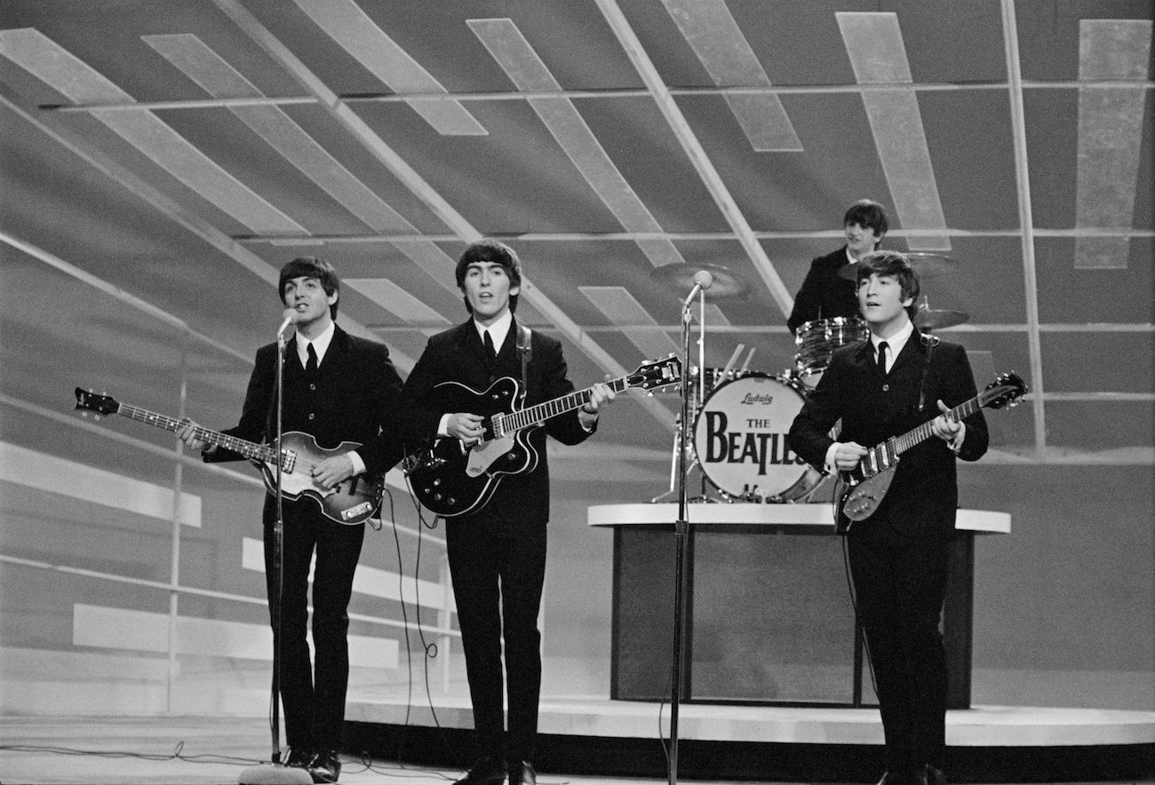 The Beatles in suits performing on 'The Ed Sullivan Show' on Feb. 9, 1964.