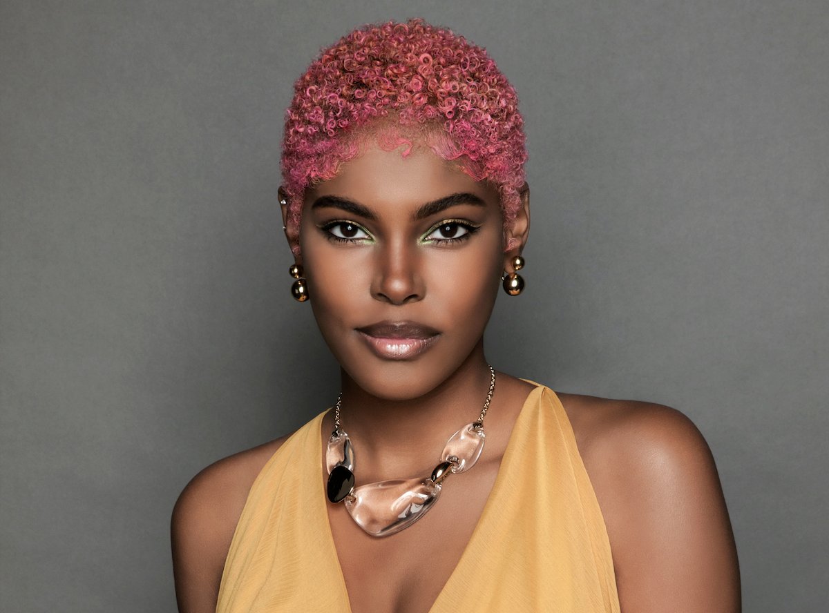 Diamond White as Paris Buckingham smiling