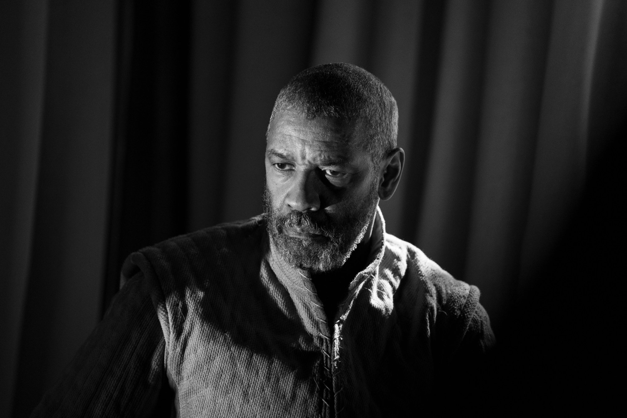 'The Tragedy of Macbeth' SAG Awards 2022 nominee Denzel Washington as Macbeth in black-and-white looking displeased
