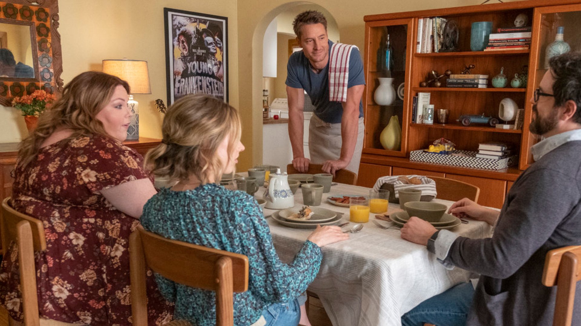 Justin Hartley as Kevin, Chrissy Metz as Kate, Caitlin Thompson as Madison, and Adam Korson as Elijah have breakfast together in ‘This Is Us’ Season 6 Episode 6