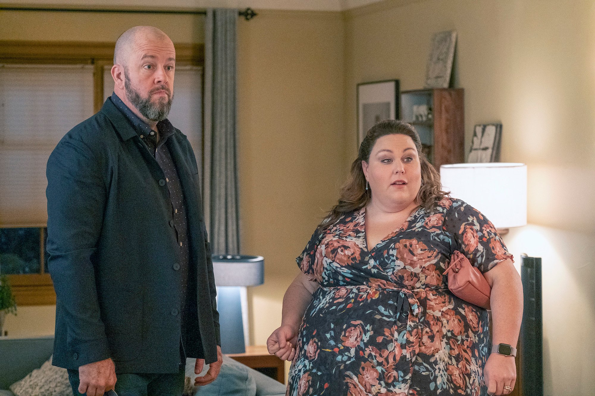 'This Is Us' Kate and Toby stand in their living room