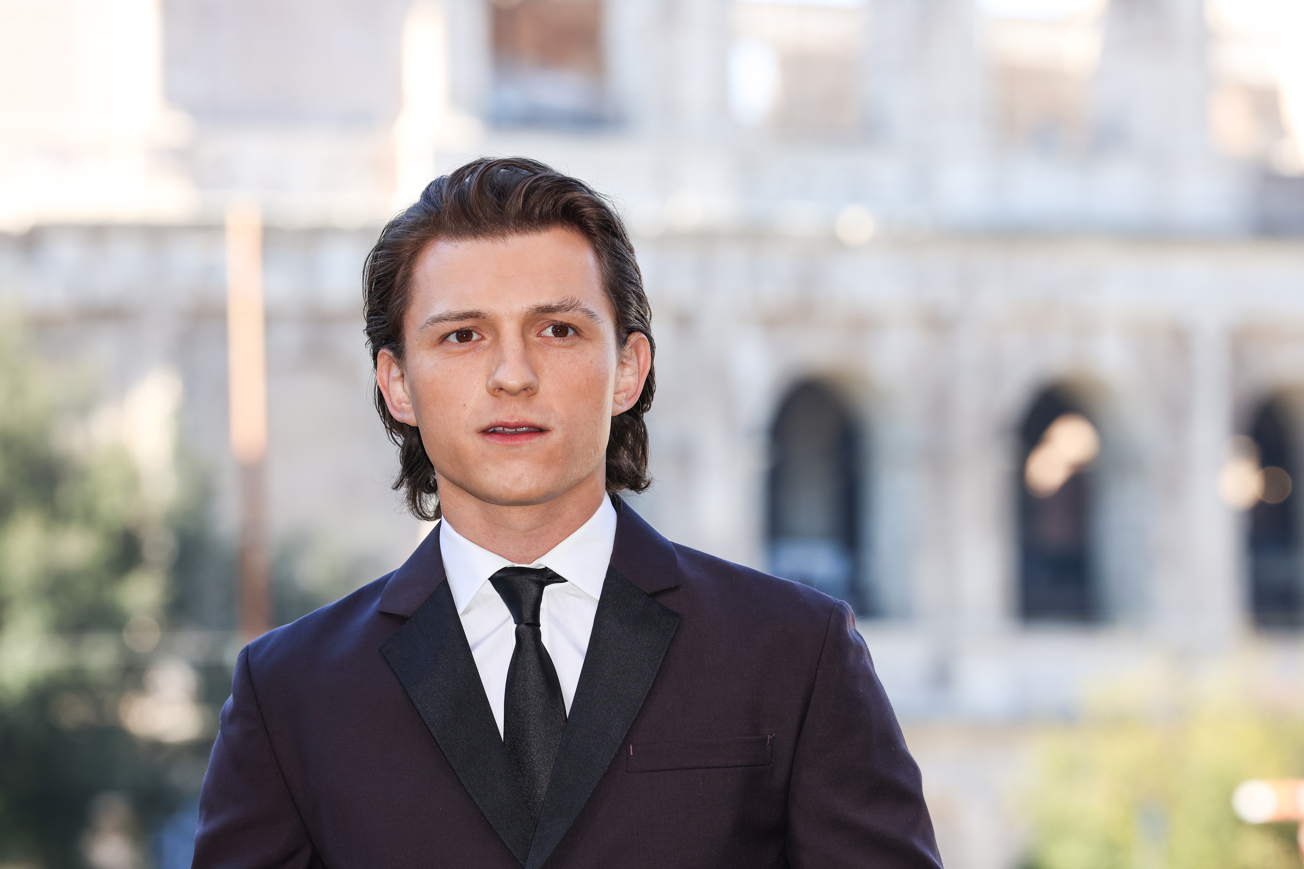 Tom Holland attends the photo call of the movie 'Uncharted'