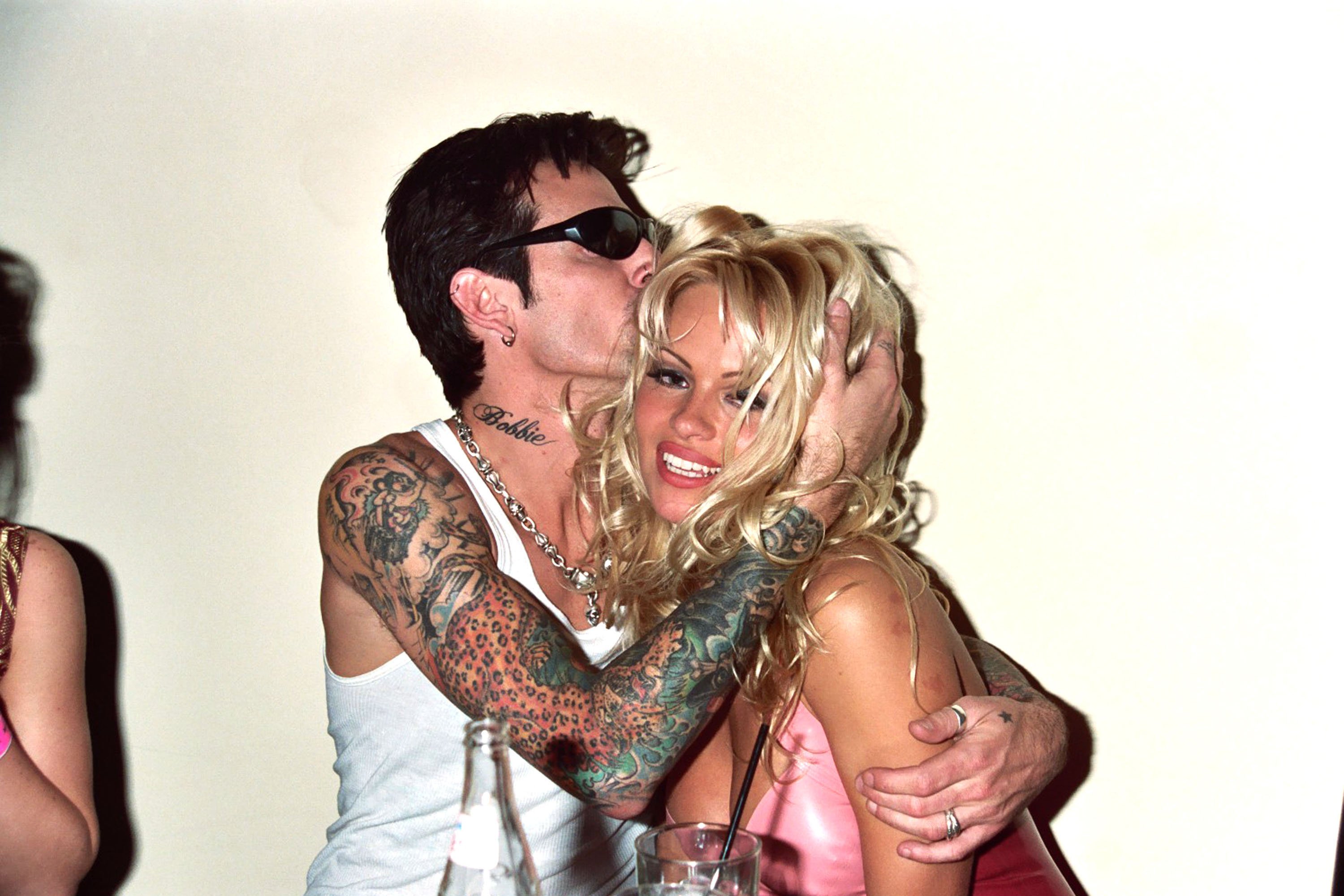 Tommy Lee kissing Pamela Anderson, who he was in a relationship with for 96 hours before getting married