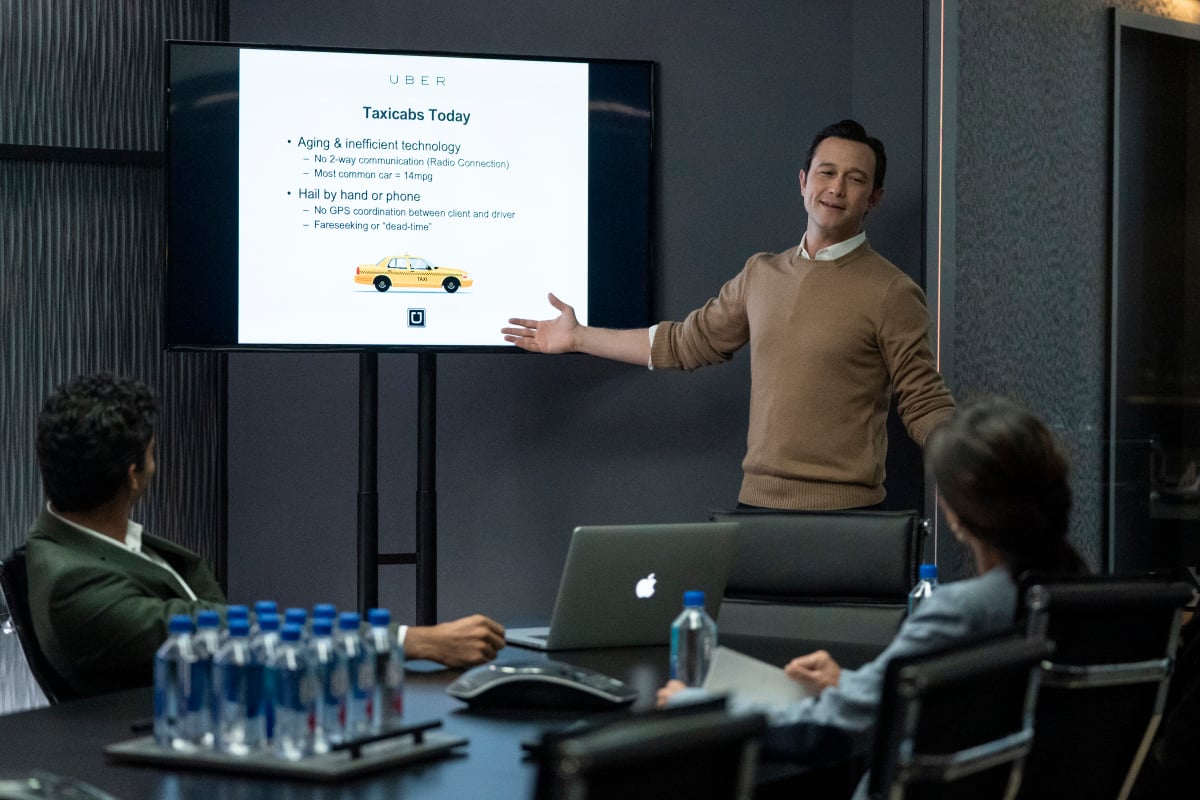 Travis Kalanick (Joseph Gordon-Levitt) presents Uber in a conference room in 'Super Pumped'