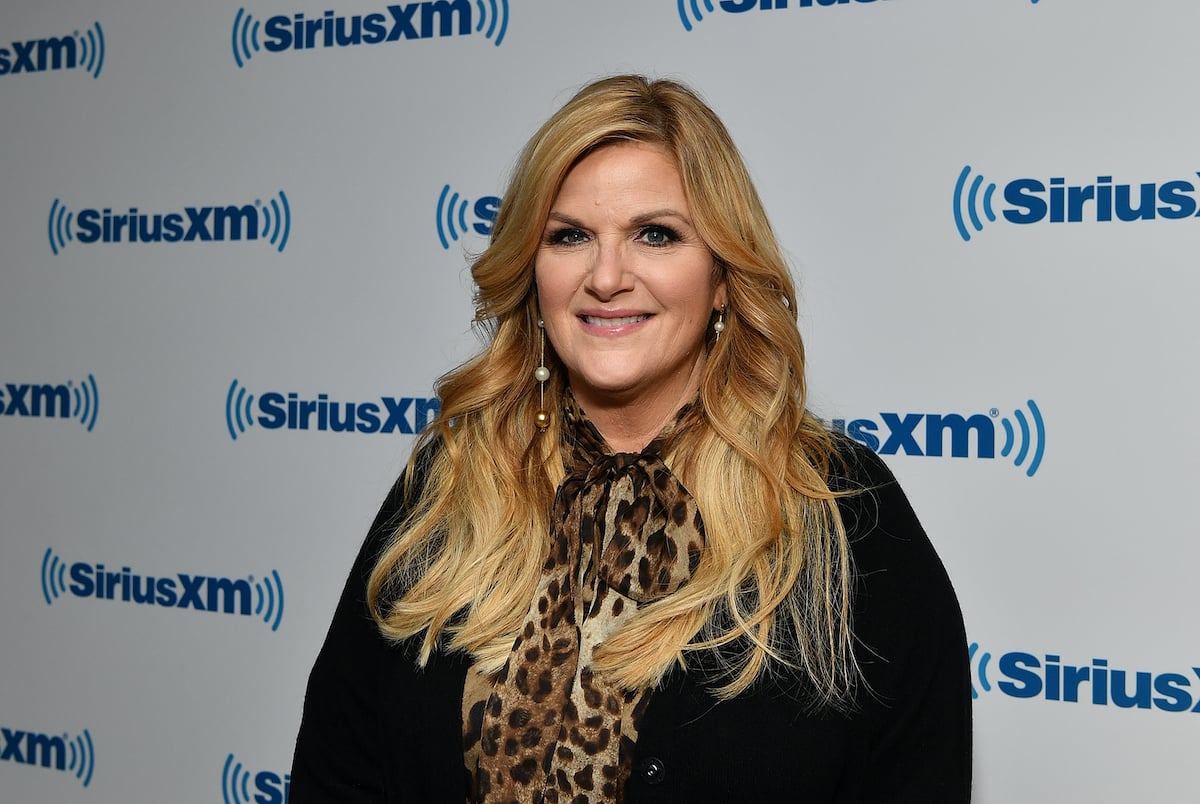 Trisha Yearwood smiling in front of a white background