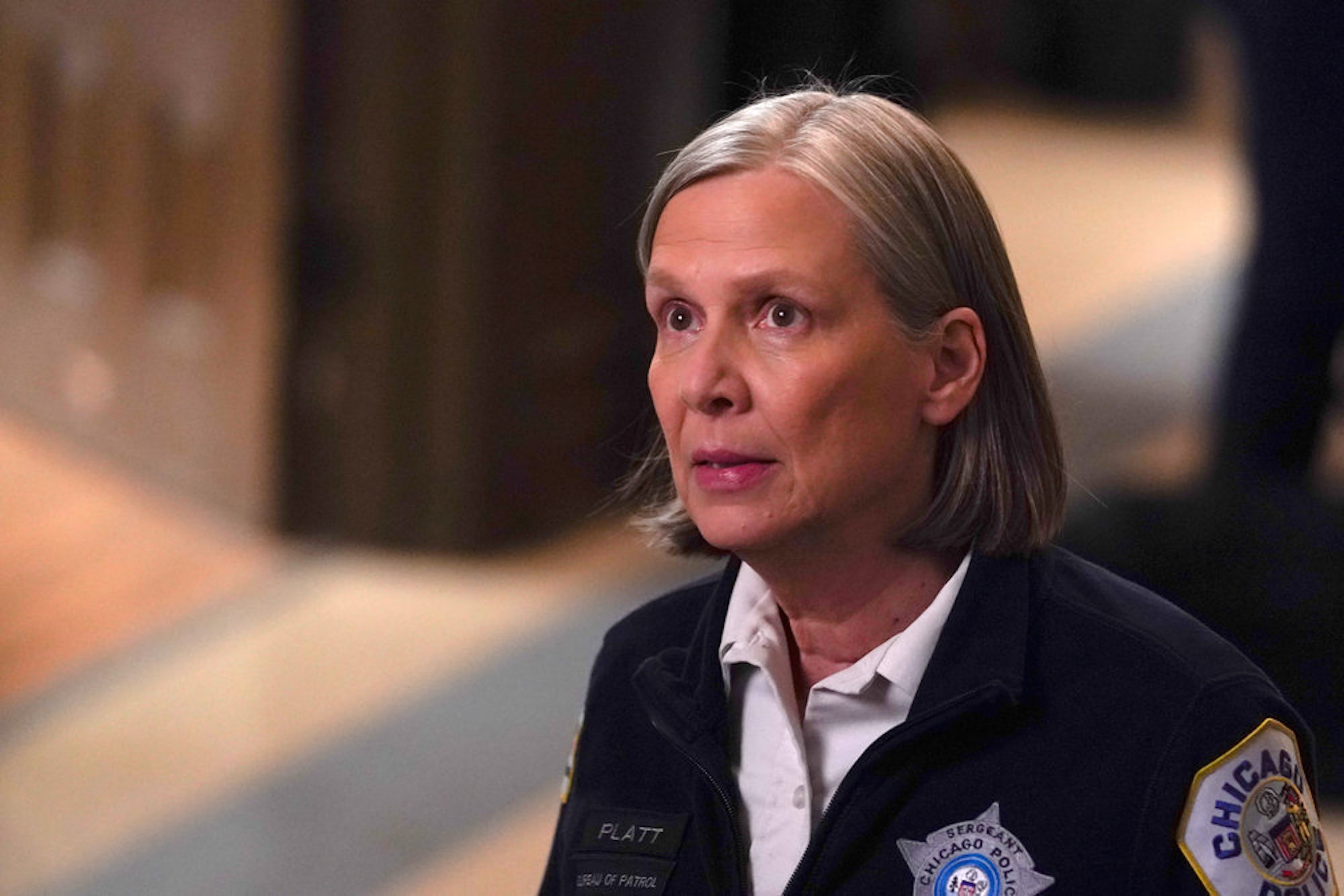 Trudy Platt looking up in 'Chicago P.D.' Season 9 Episode 13