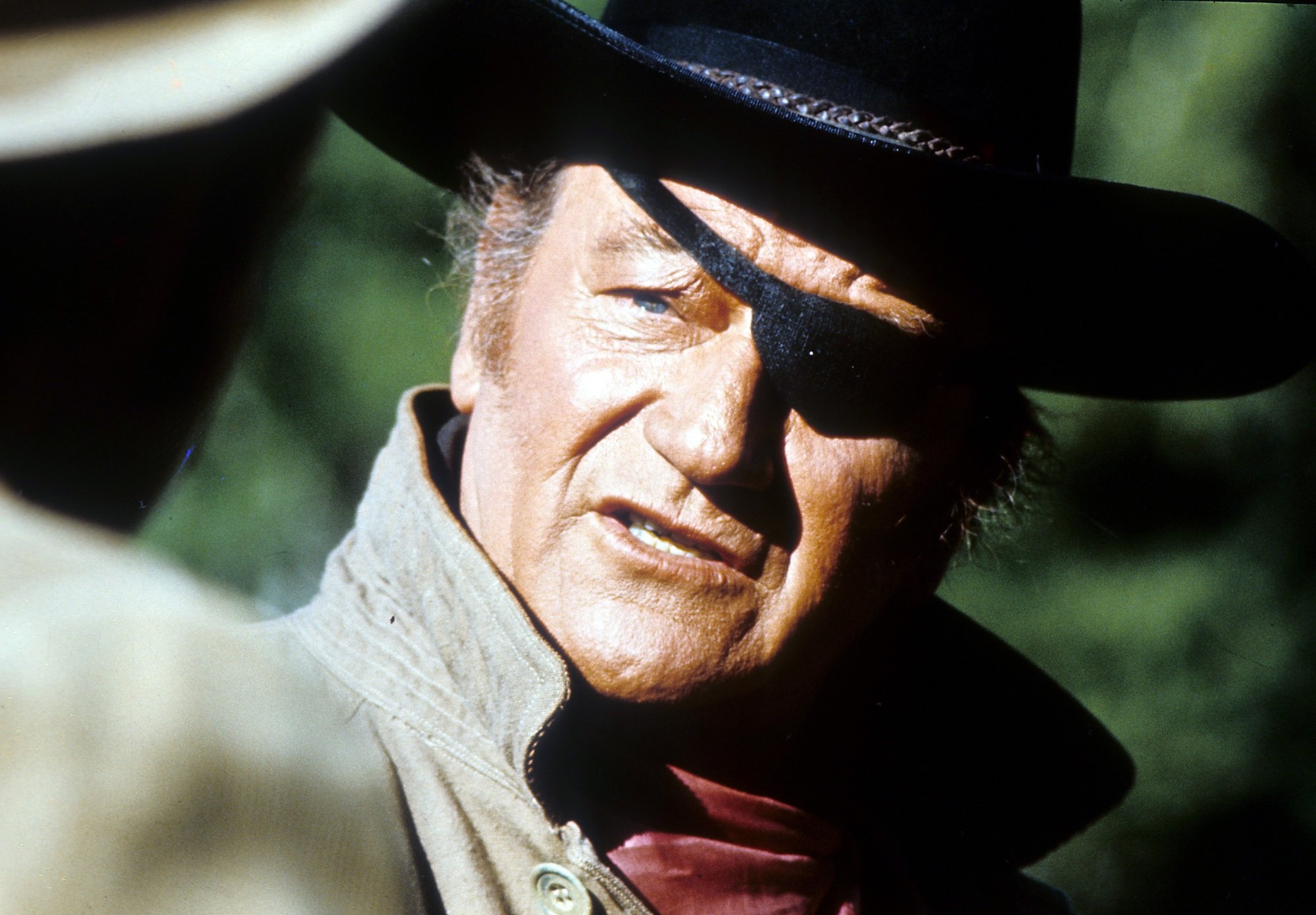 'True Grit' John Wayne as U.S. Marshal Rooster Cogburn in article about fight with Robert Duvall with an eye patch on