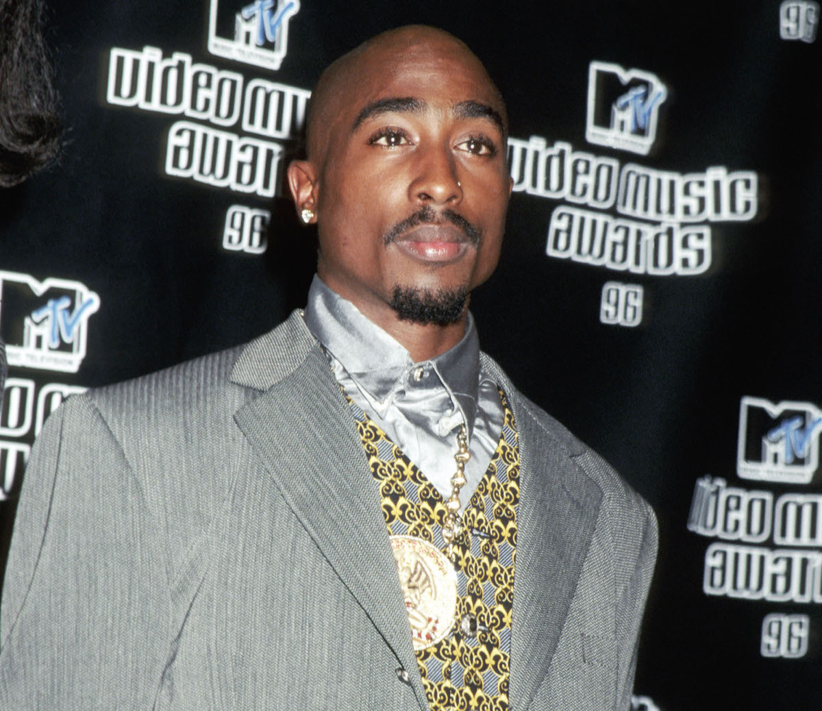 Tupac Shakur poses on the red carpet