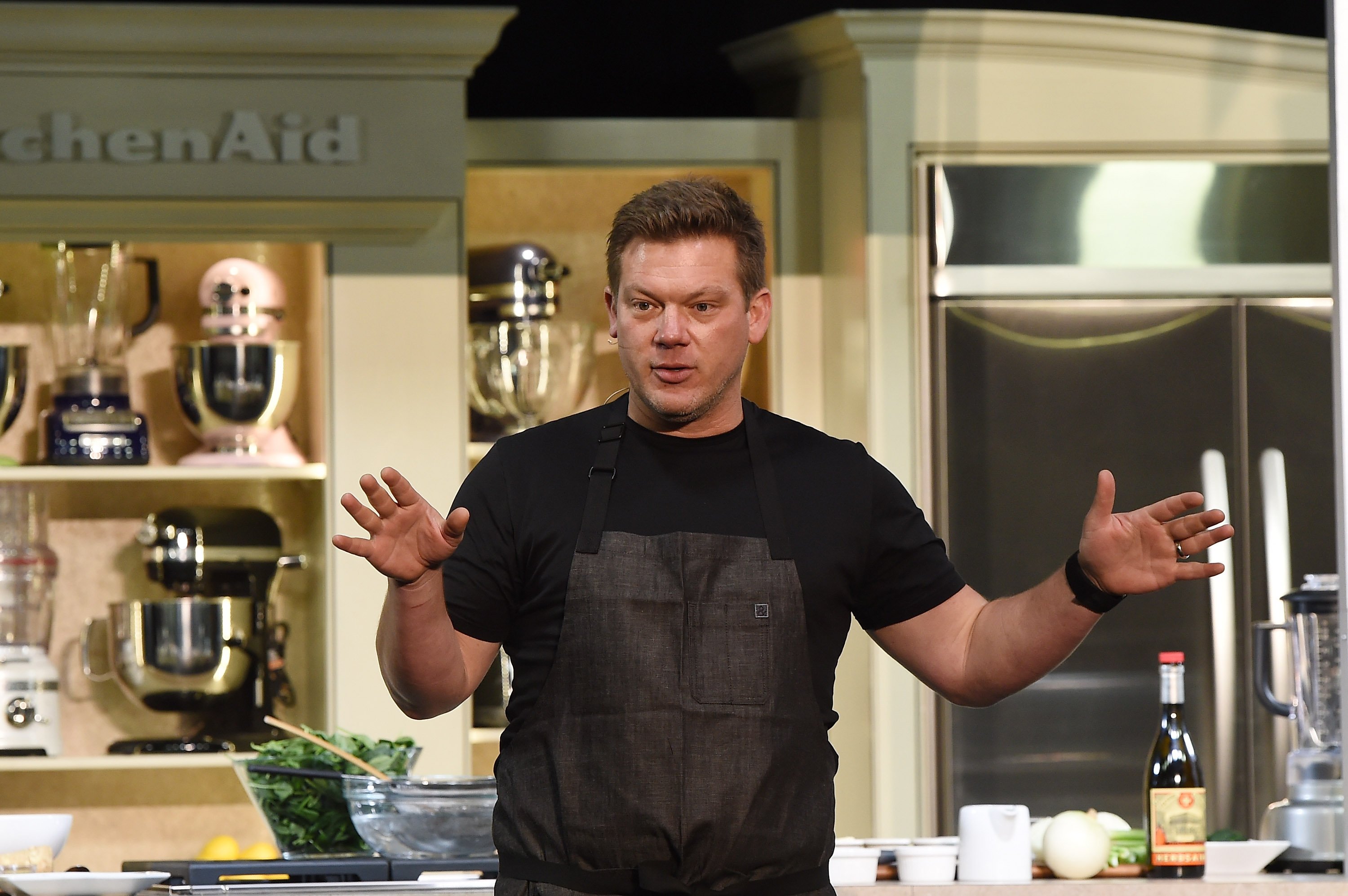 Food Network star Tyler Florence wears a black T-shirt in this photo.