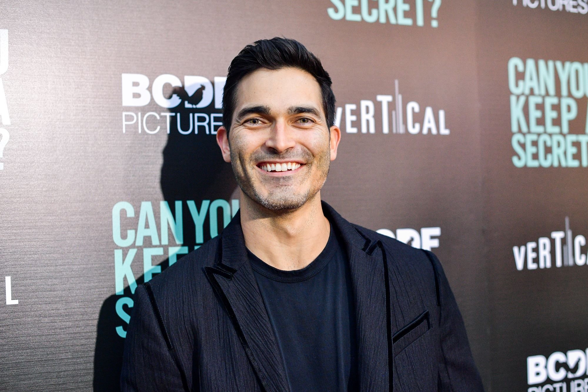 'Superman & Lois' Season 2 star Tyler Hoechlin wears a black suit over a black shirt.