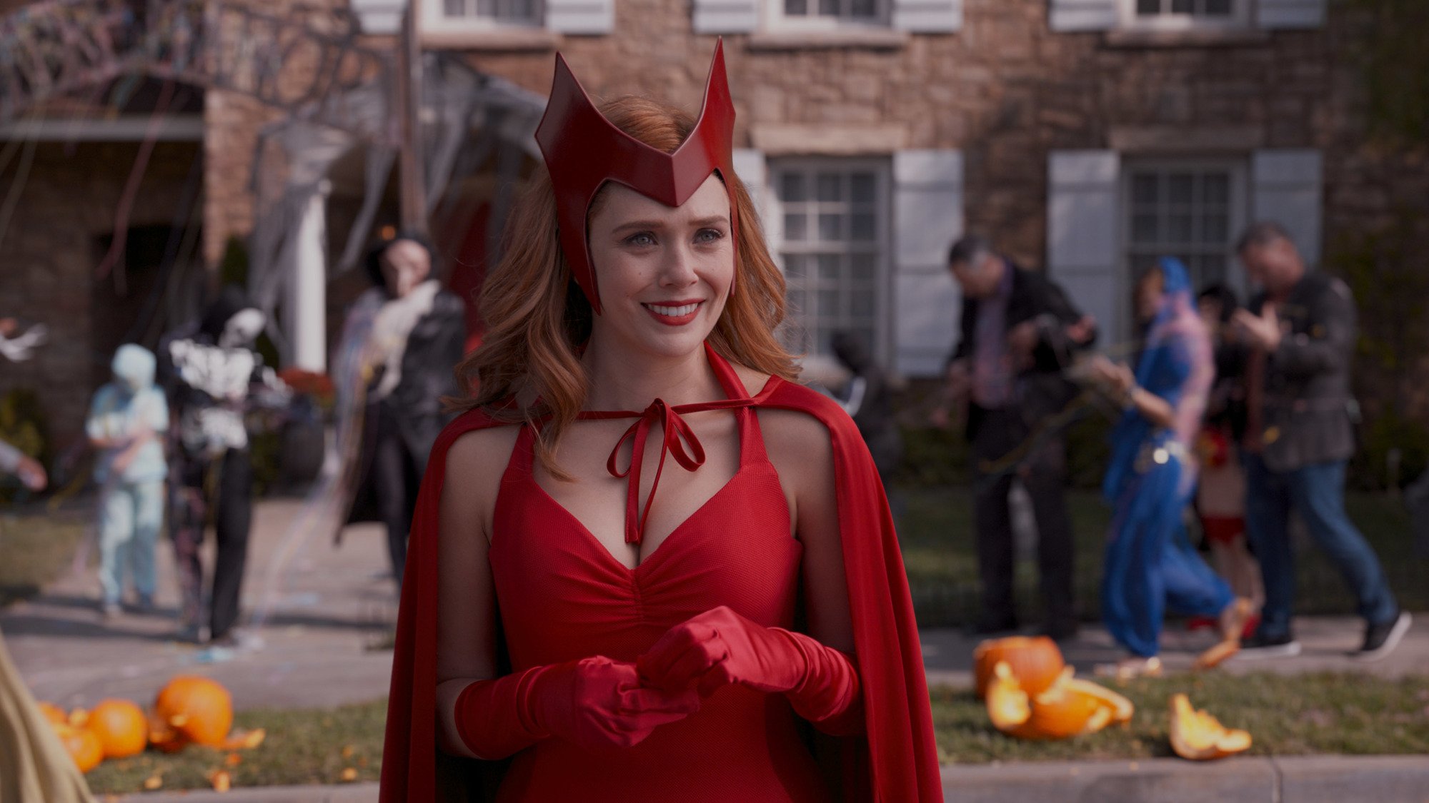 Elizabeth Olsen as Wanda Maximoff in 'WandaVision.' She's wearing a Halloween costume that resembles Scarlet Witch's comics getup.
