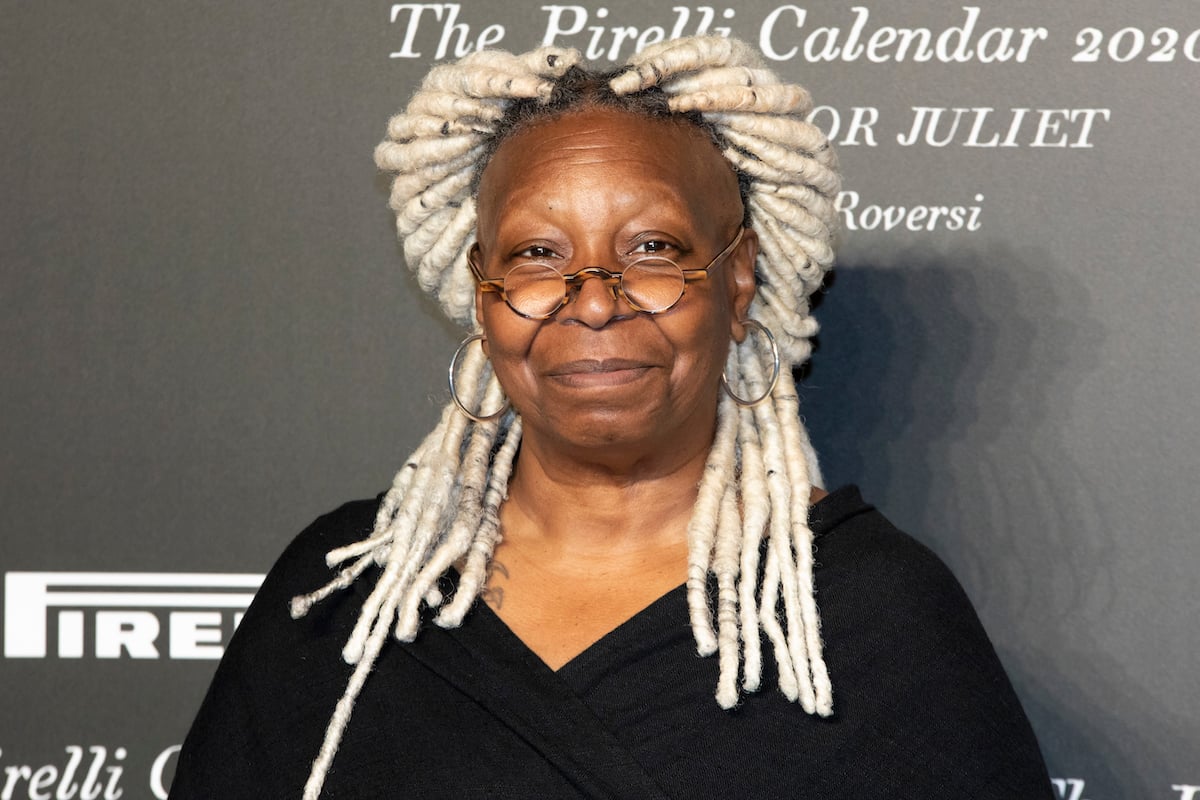Whoopi Goldberg smiles at an event.