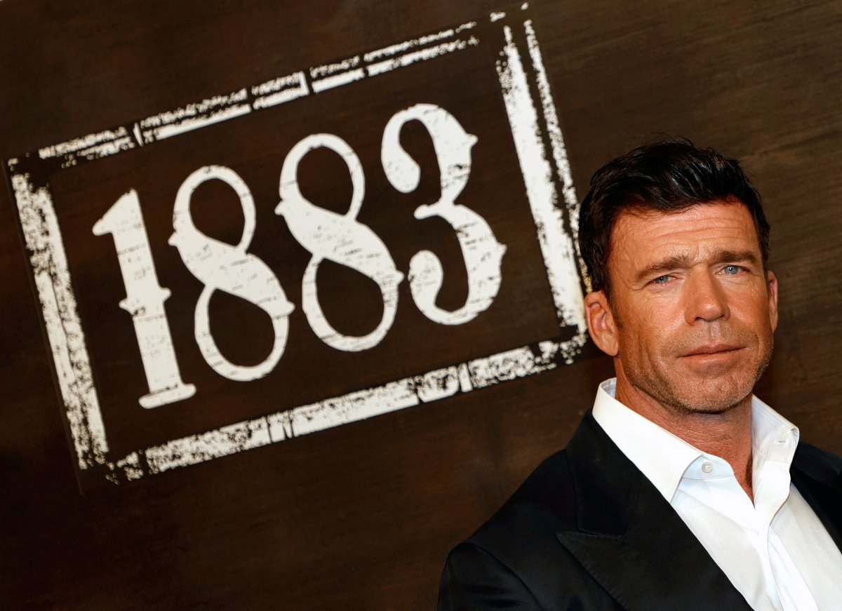 Yellowstone creator Taylor Sheridan in a dark jacket and white shirt arrives at the world premiere of 1883 at Encore Beach Club at Wynn Las Vegas on December 11, 2021 in Las Vegas, Nevada