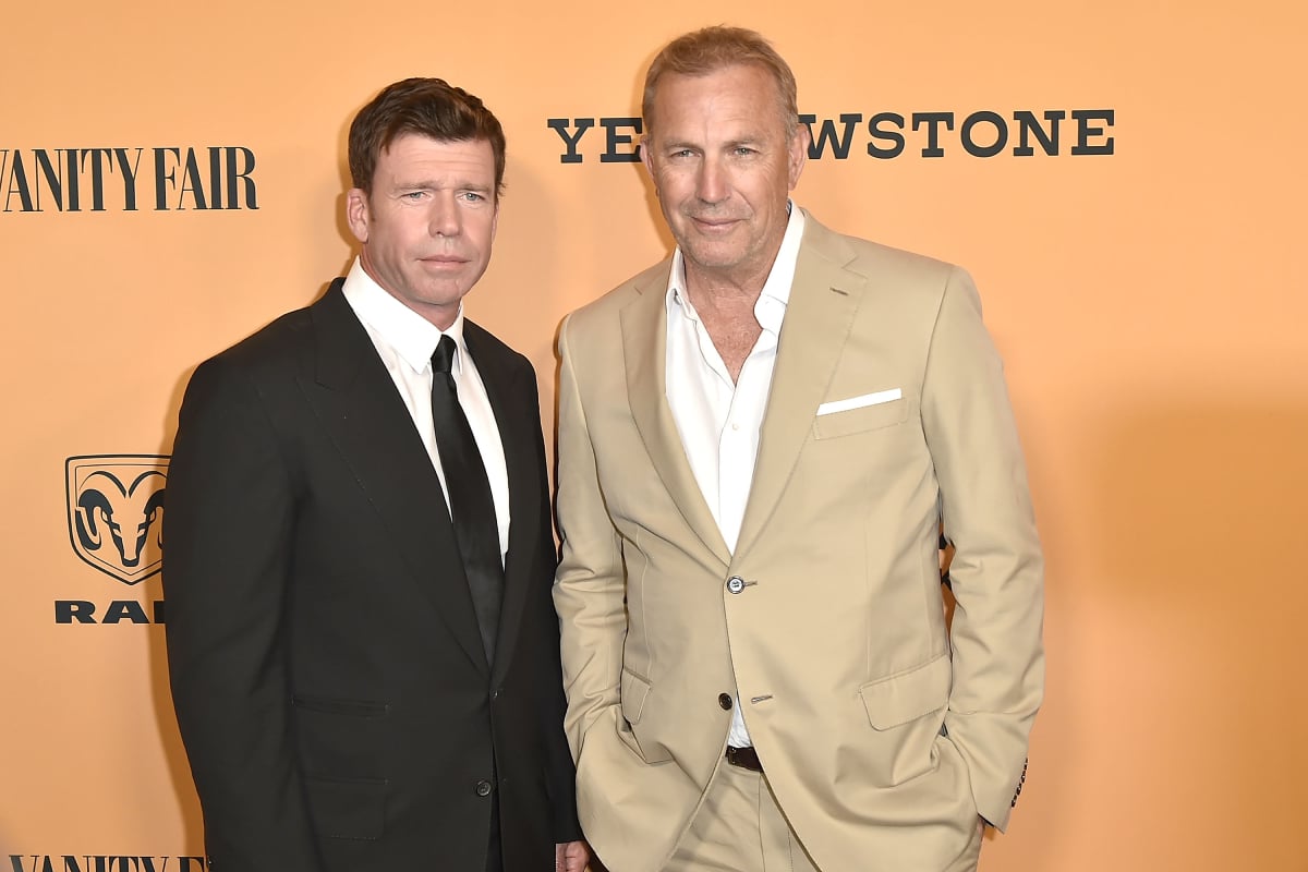 Yellowstone creator Taylor Sheridan in a black suit and Kevin Costner wearing tan attend the world premiere of the hit show at Paramount Studios on June 11, 2018 in Los Angeles, California