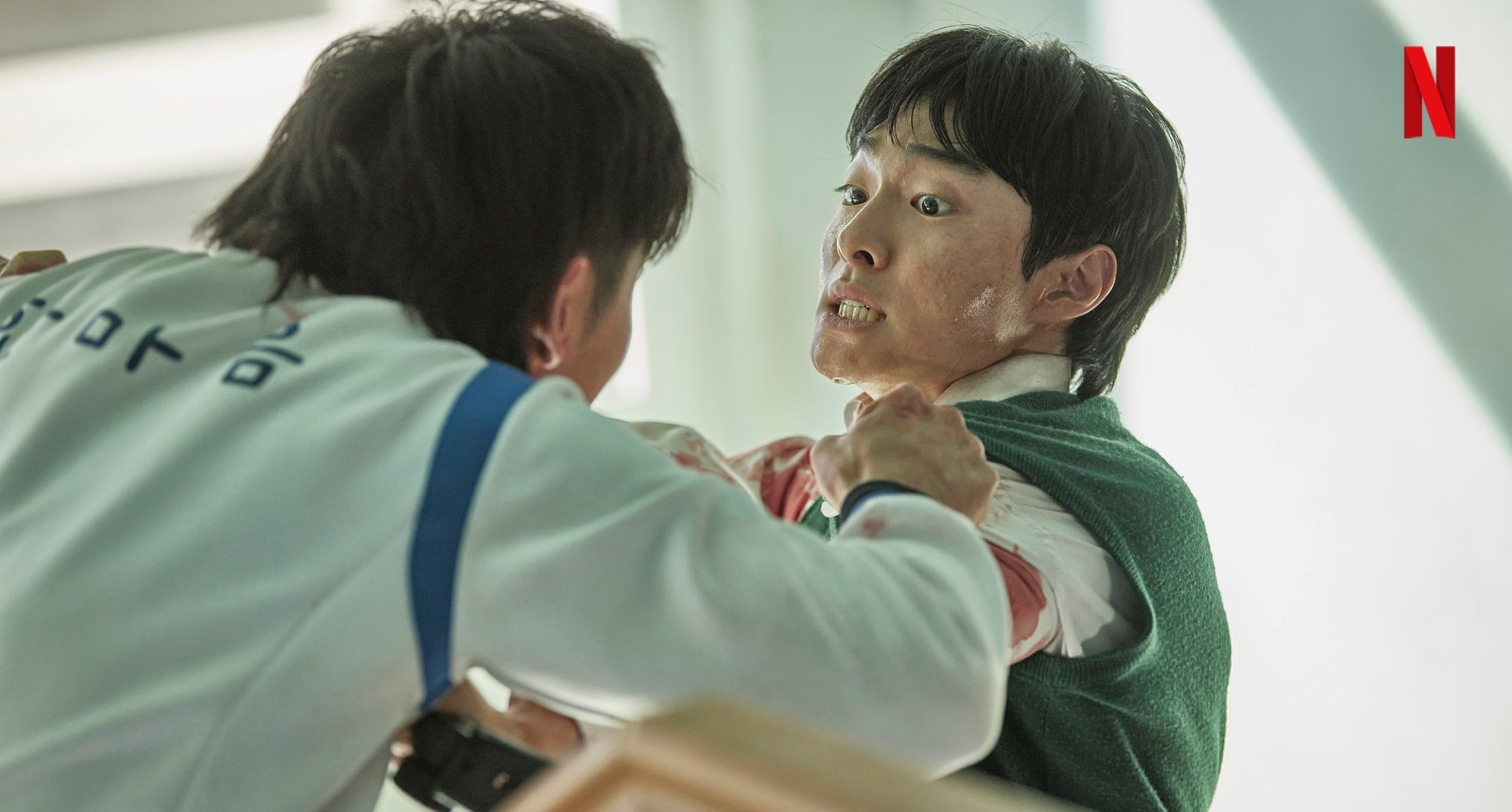 Yoon Chan-young as Cheon-sang in 'All of Us Are Dead' being attacked by Gwi-nam.
