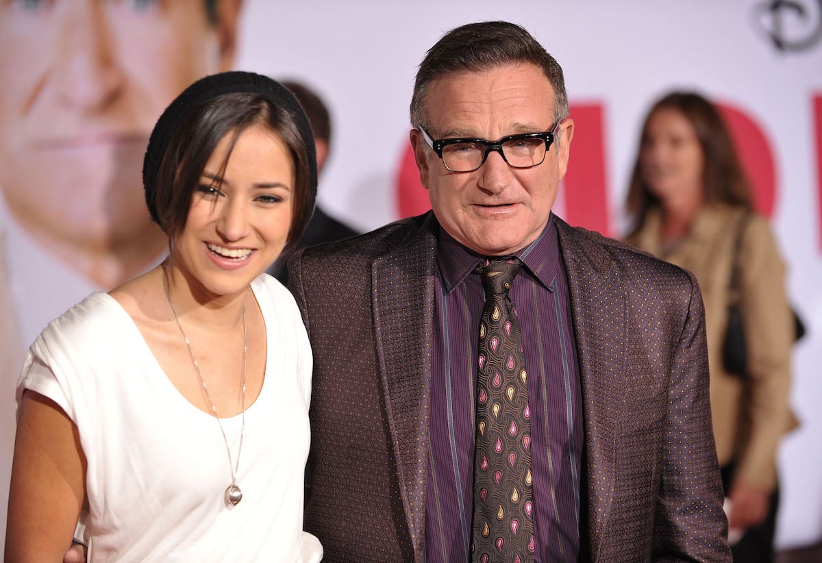 Zelda Williams and Robin Williams pose together at an event.