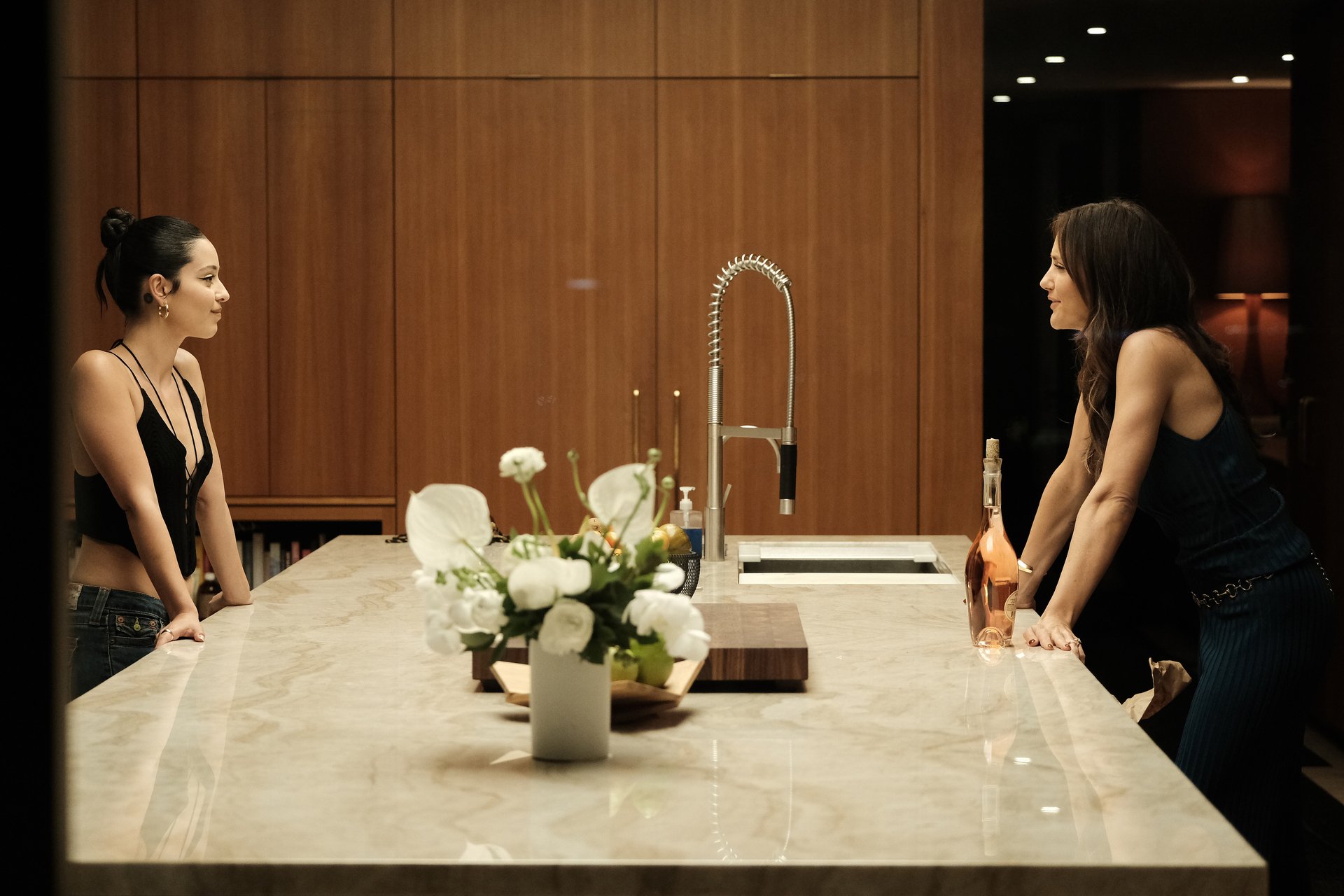 In 'Euphoria' Episode 6, Maddy (Alexa Demie) and Samantha (Minka Kelly) look at each other across a marble counter top