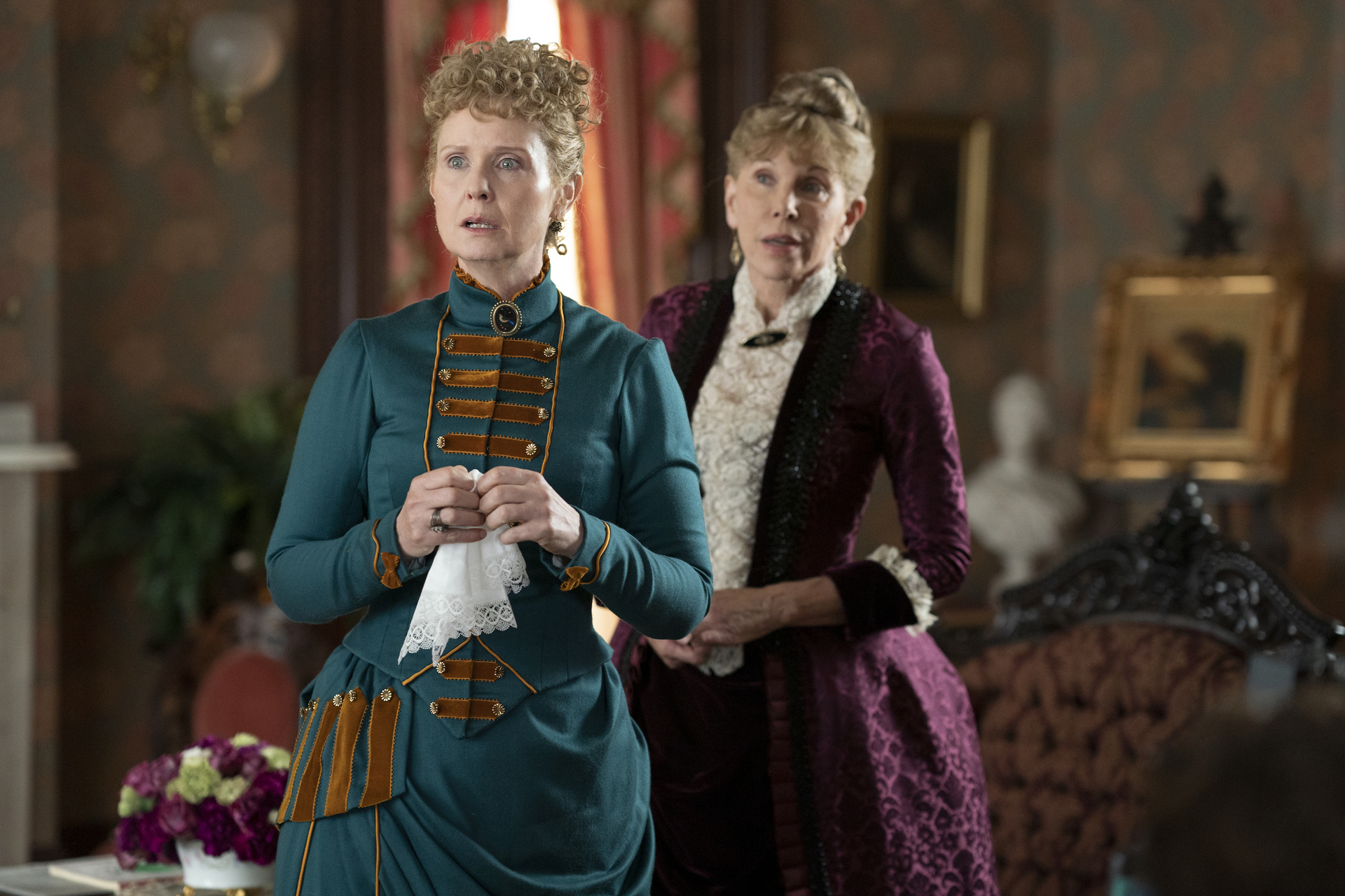 Cynthia Nixon wearing a teal dress and Christine Baranski in a purple dress in 'The Gilded Age'