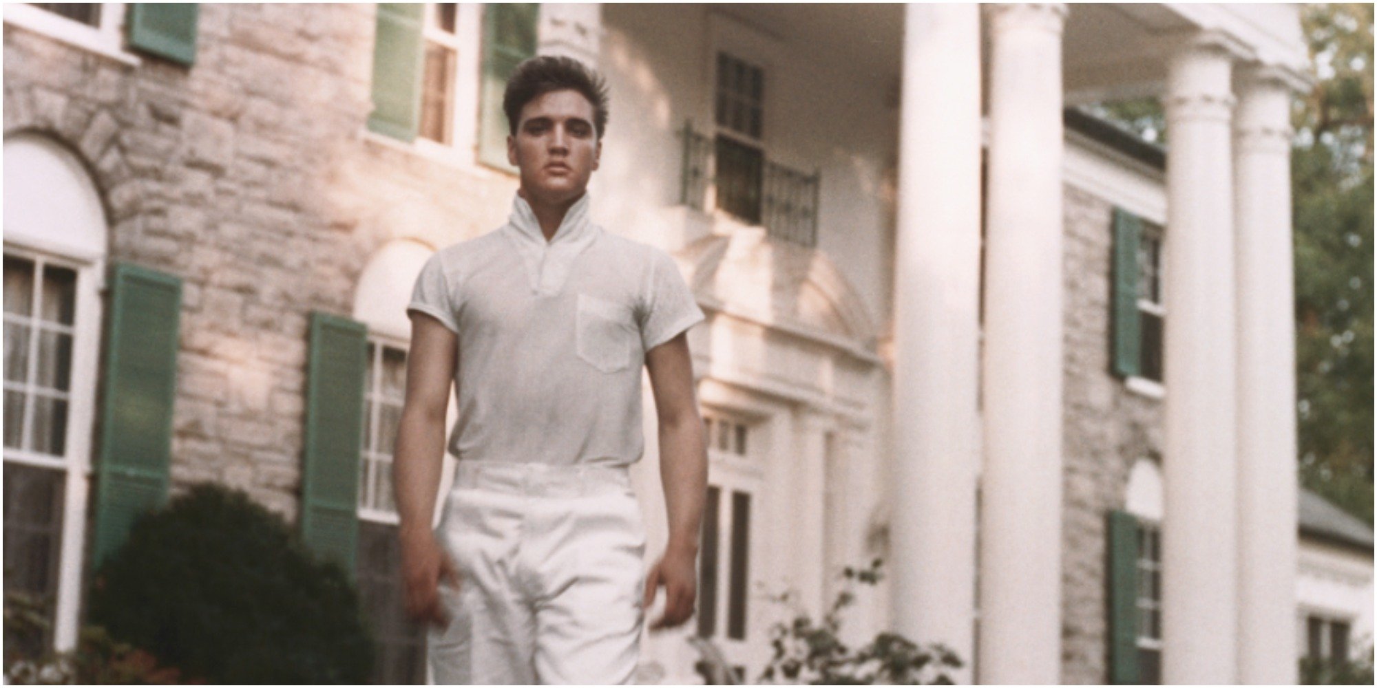 Elvis Presley outside his Graceland mansion in Memphis, TN.